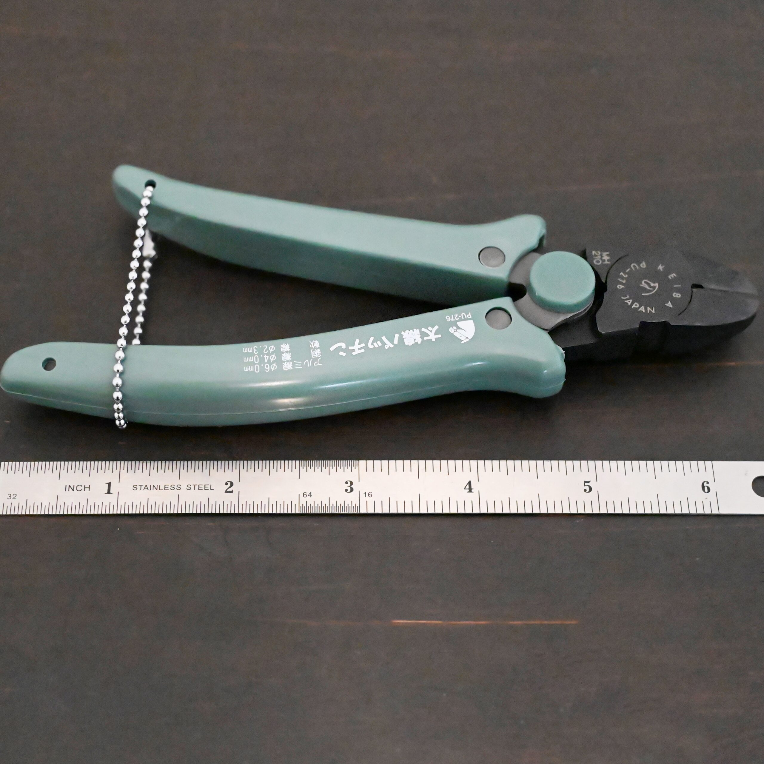 Felix Flush Cutting Pliers Power Max Full Flush Cutting Pliers - Turquoise plastic handle shown next to ruler