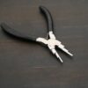 Double Stepped Mandrel Pliers - Black rubber handle shown on dark background