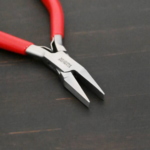 Flat Jaw Pliers - Red rubber handle shown on dark background
