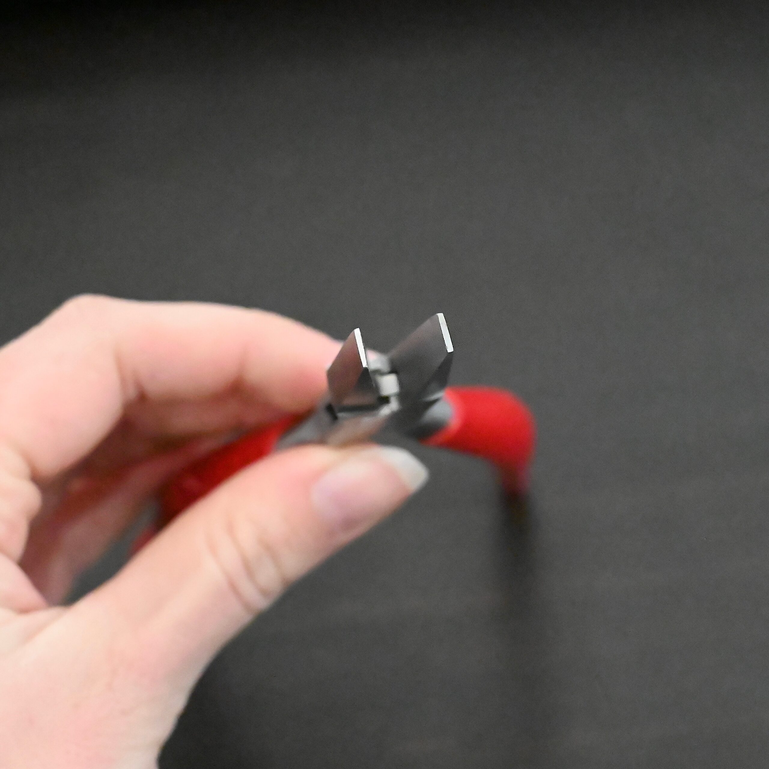 Flat Jaw Pliers - Red rubber handle shown in hand