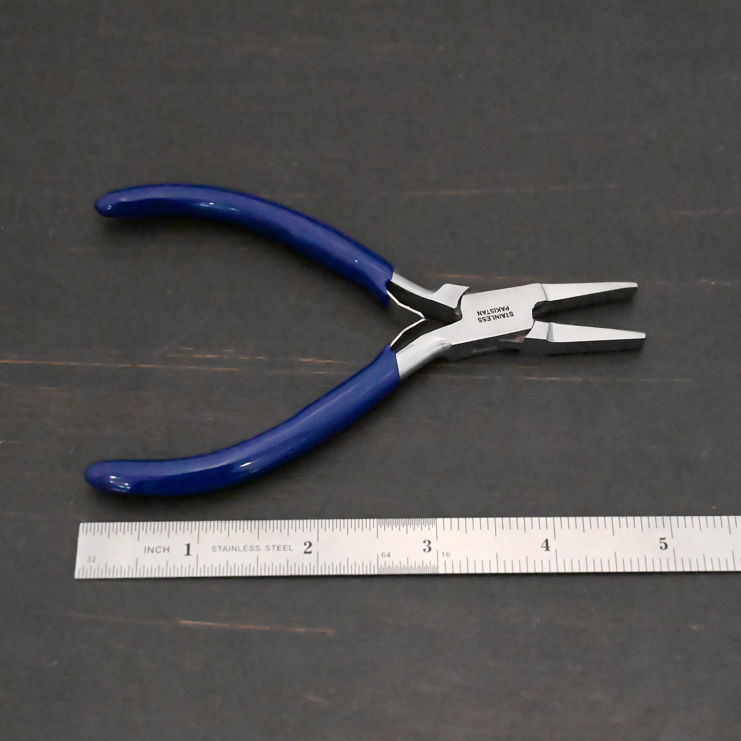 Ring Bending Pliers - Blue rubber handle shown by ruler