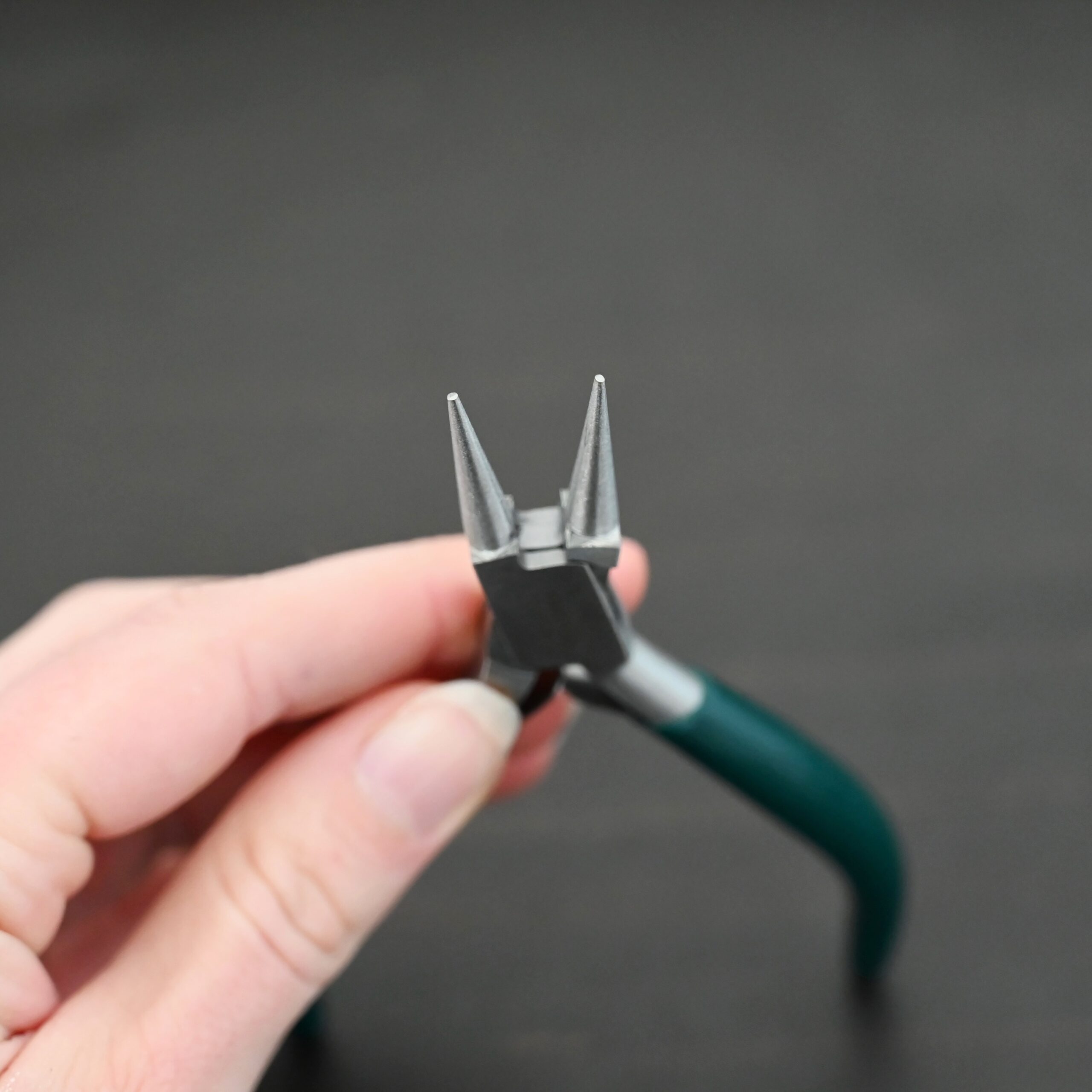 Wire Wrapping pliers - Dark Green rubber handle shown in hand
