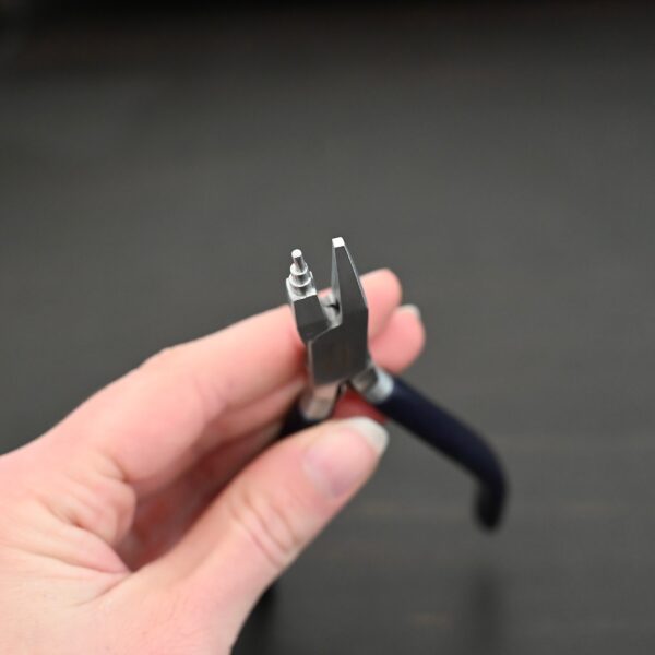 Small Stepped Mandrel pliers - Black rubber handle shown in hand