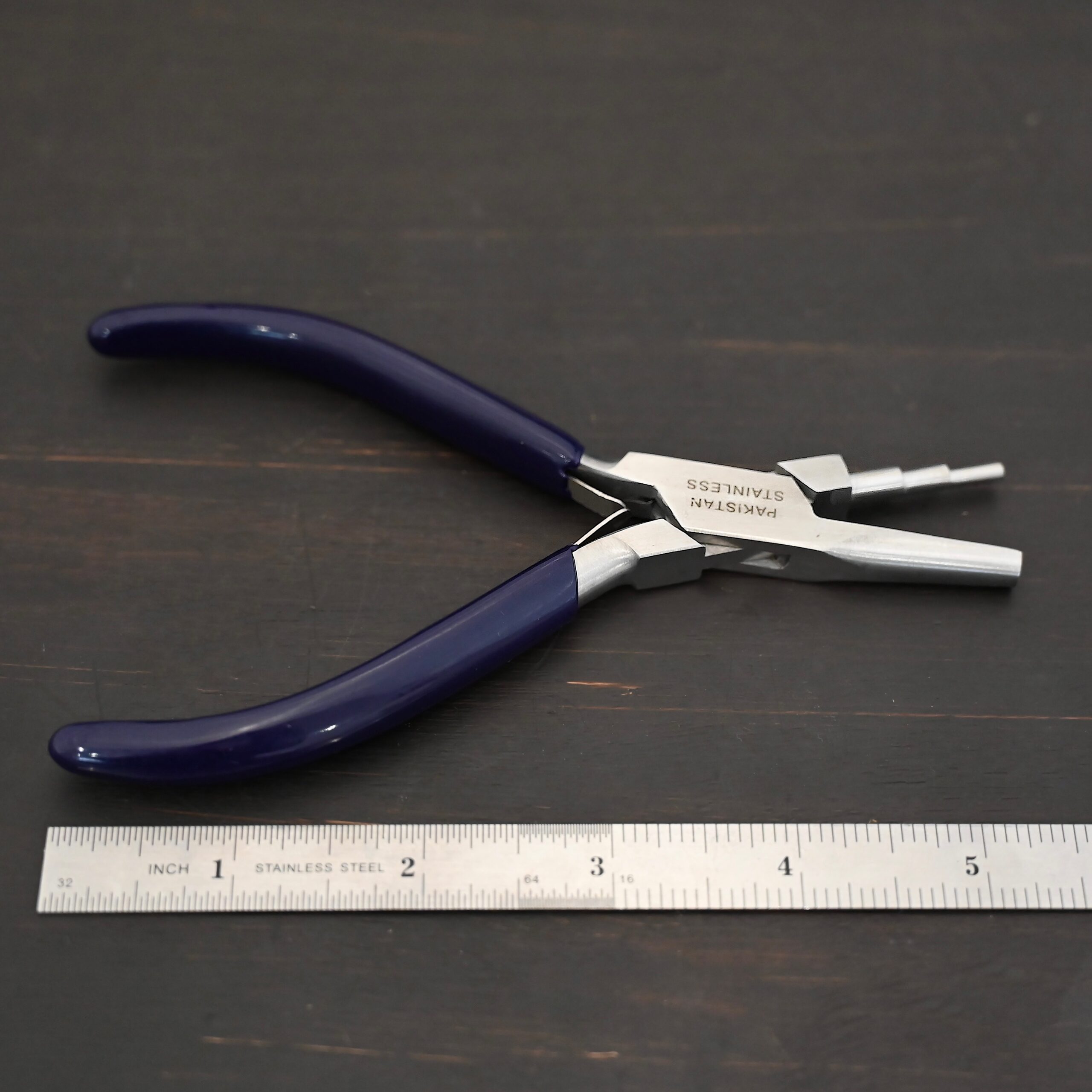 Medium Stepped Mandrel pliers - Dark Blue rubber handle shown by ruler