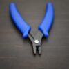 Crimping pliers - Blue Plastic handle shown on dark background