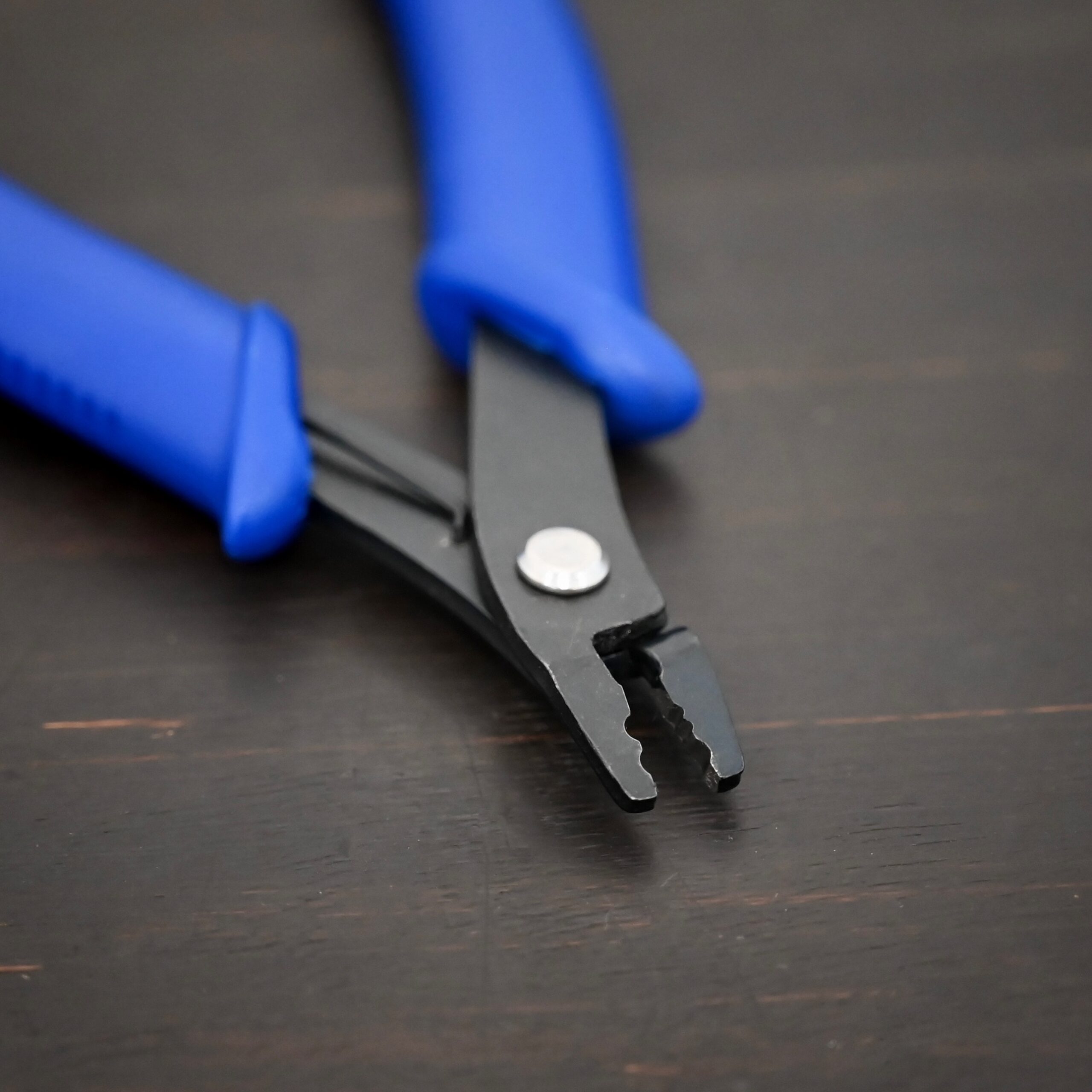 Crimping pliers - Blue Plastic handle shown on dark background