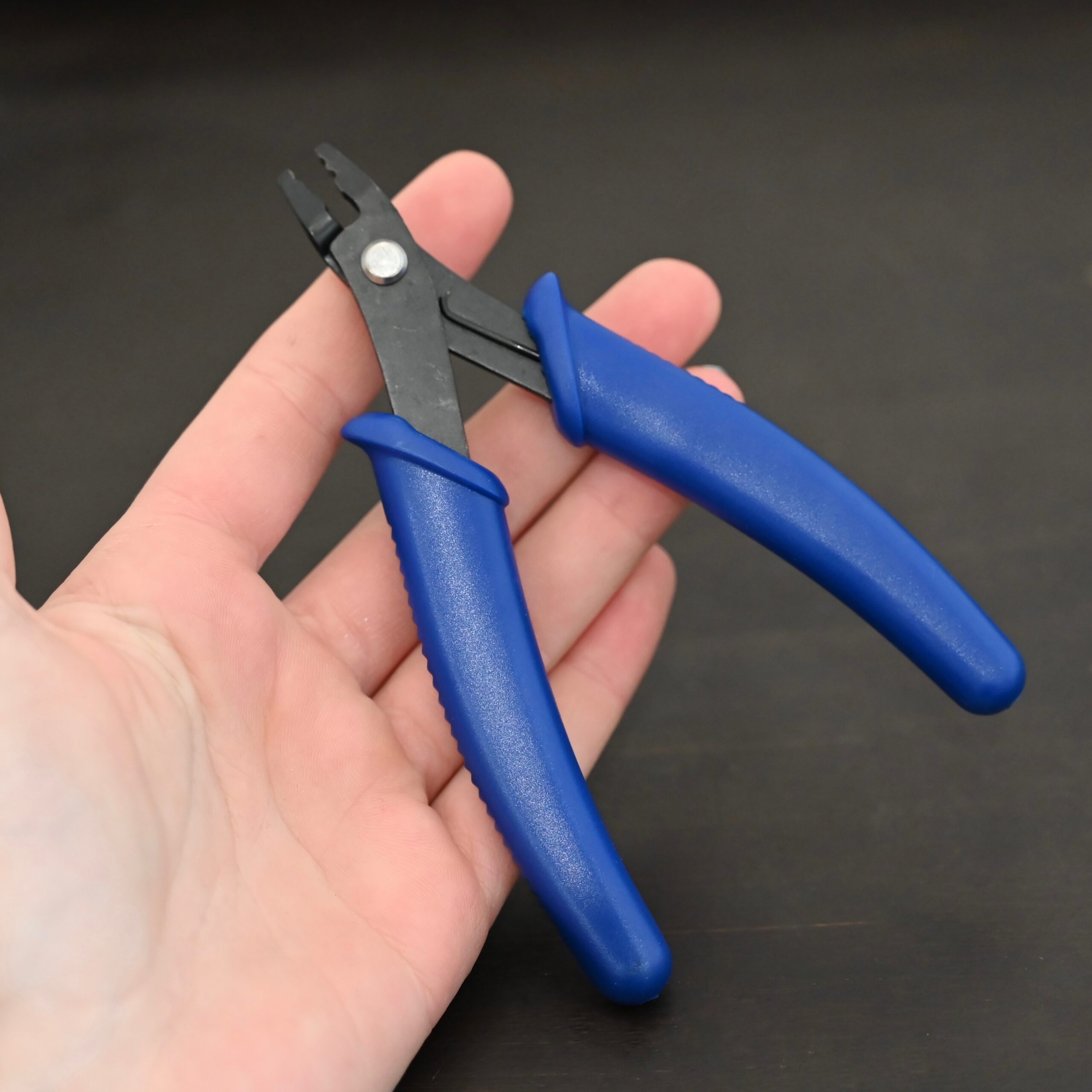 Crimping pliers - Blue Plastic handle shown in hand