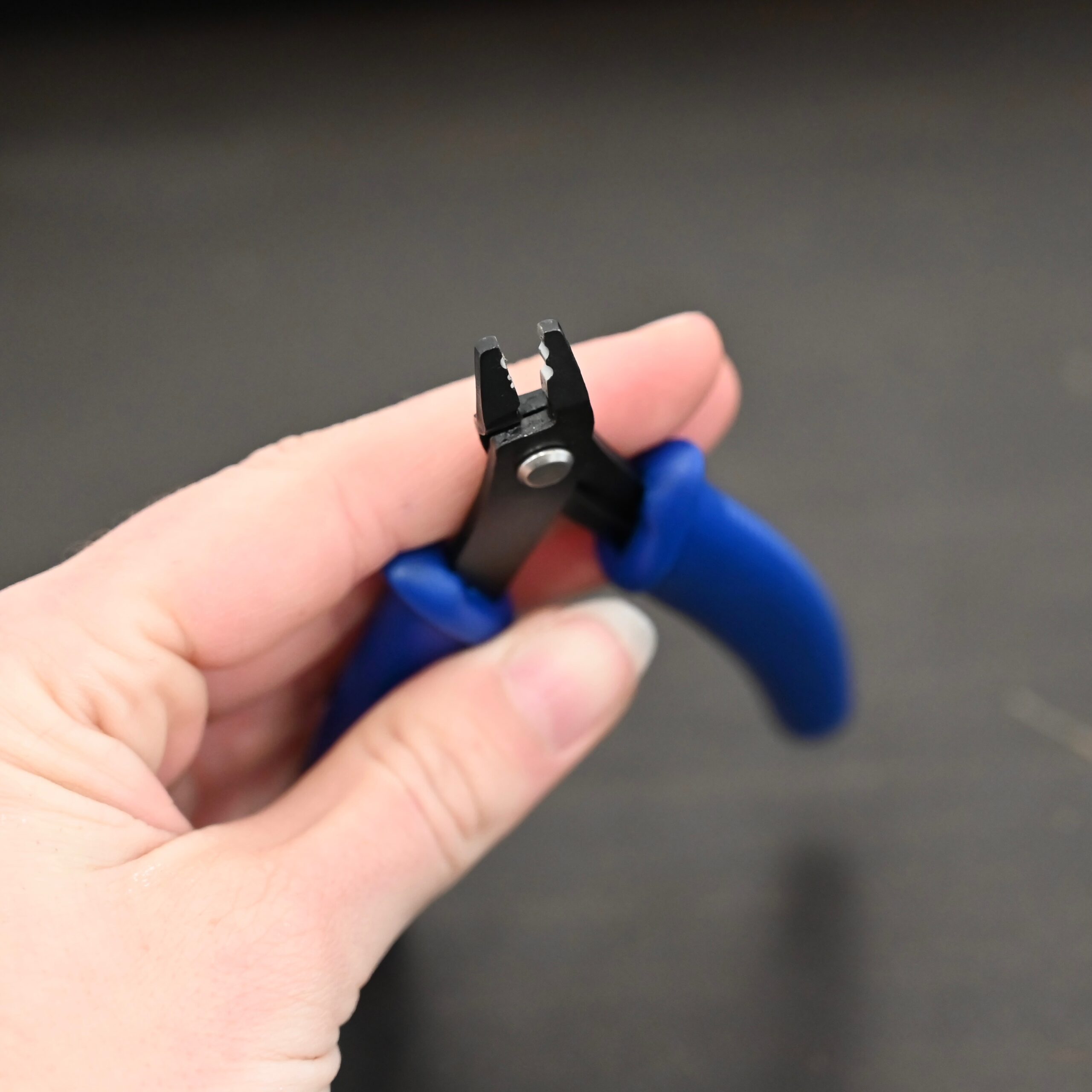Crimping pliers - Blue Plastic handle shown in hand