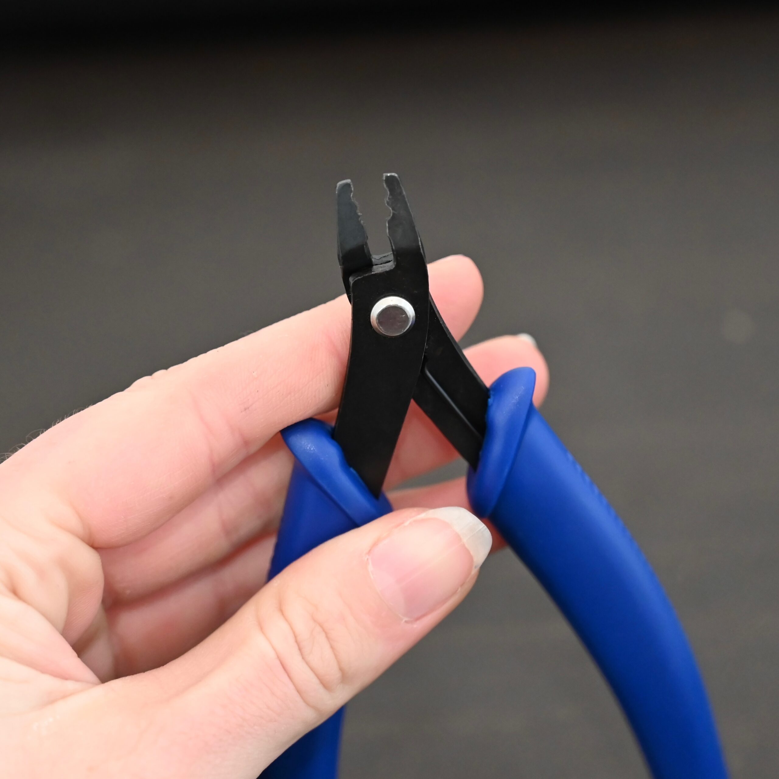 Crimping pliers - Blue Plastic handle shown in hand