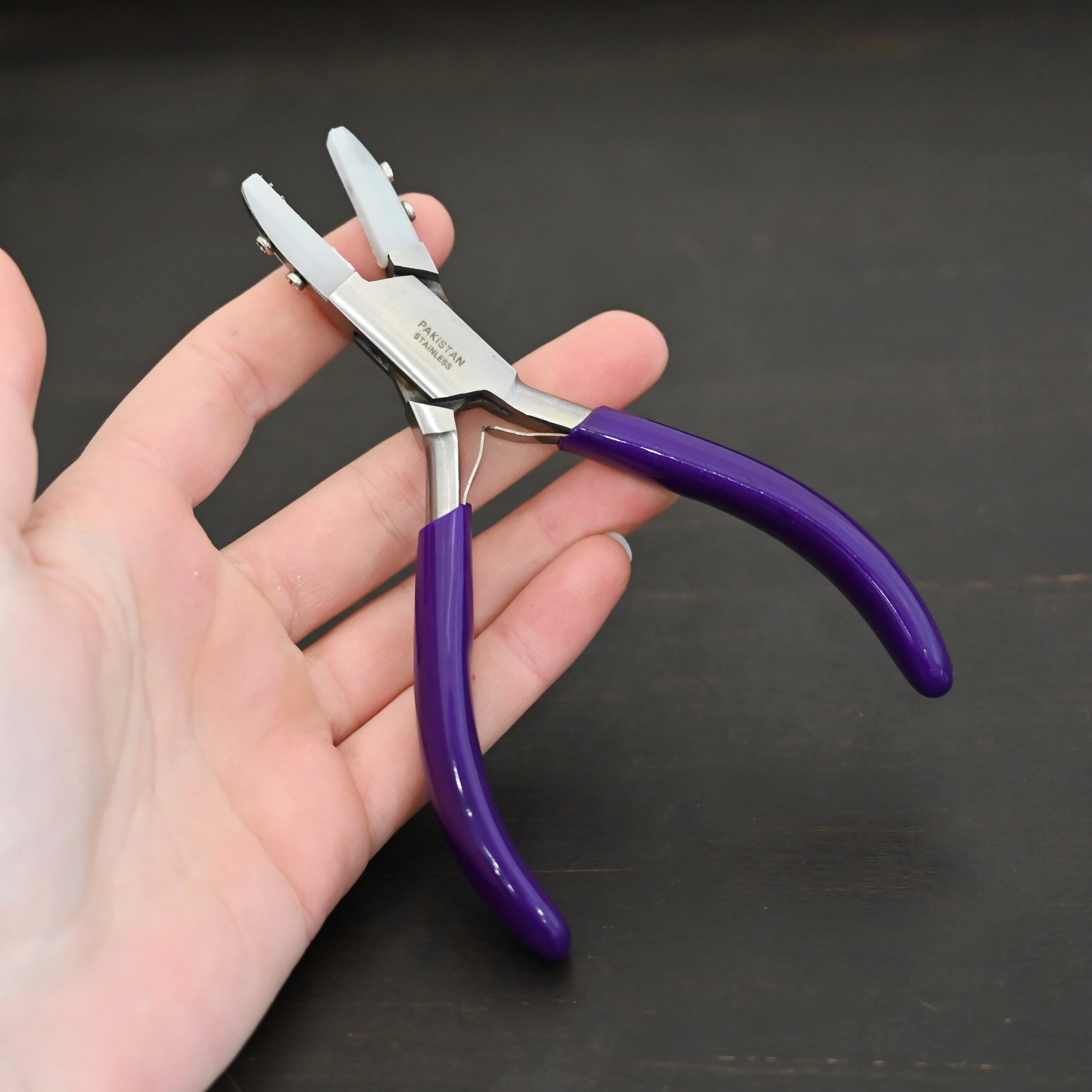 Nylon Jaw Pliers - Purple Rubber handle shown in hand