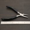 Round/Flat Nosed Pliers - Black Rubber handle shown by ruler