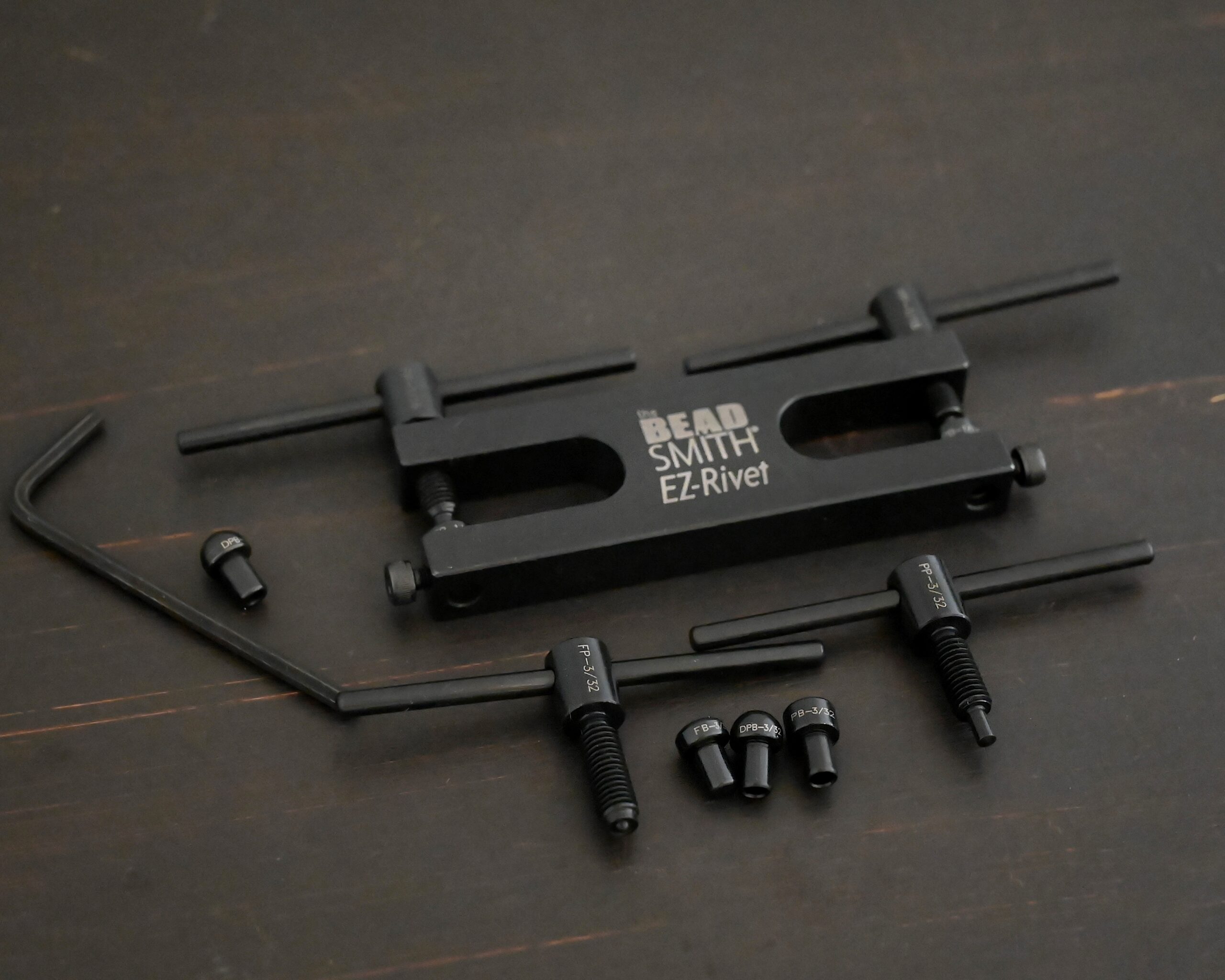 EZ Riveting Tool Complete Kit all parts shown on dark background