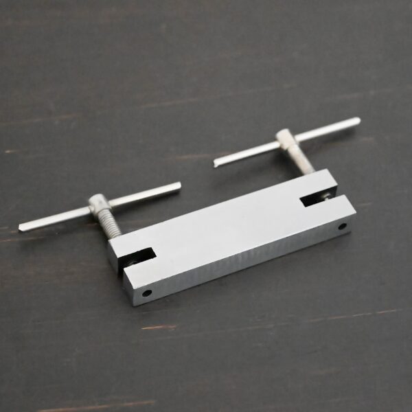 Stainless Steel Hole Punch & Twist Tool shown on dark background