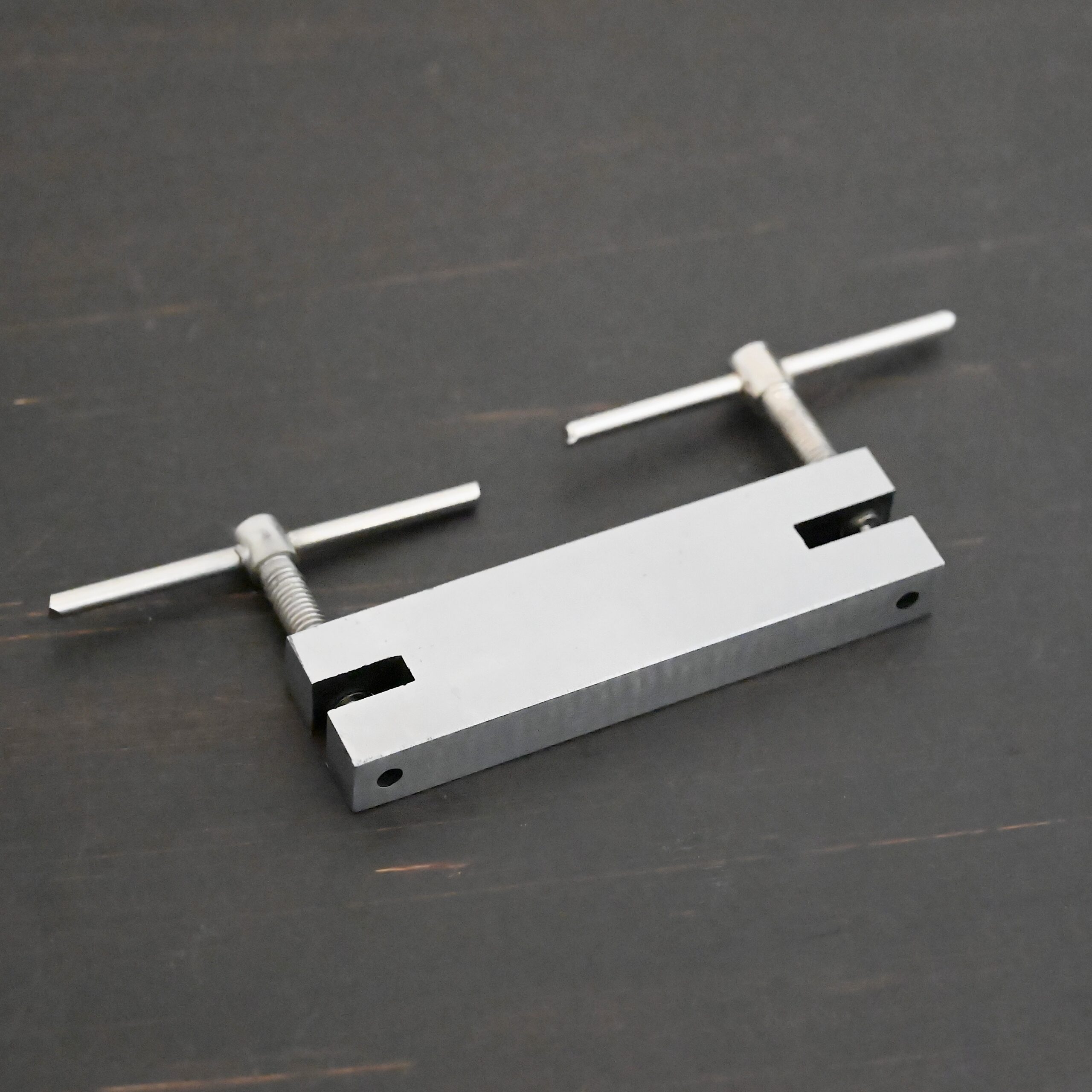 Stainless Steel Hole Punch & Twist Tool shown on dark background