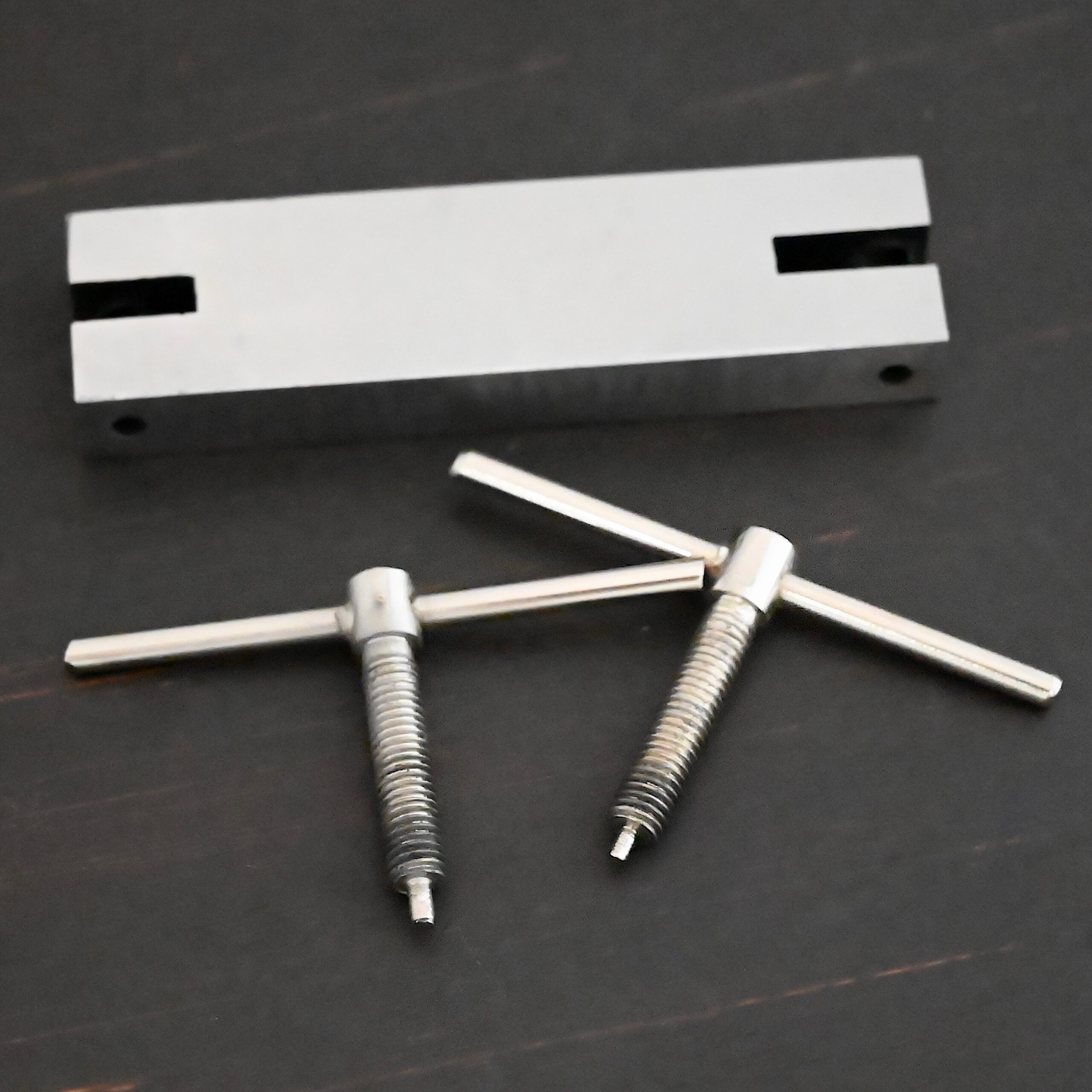 Stainless Steel Hole Punch & Twist Tool shown on dark background