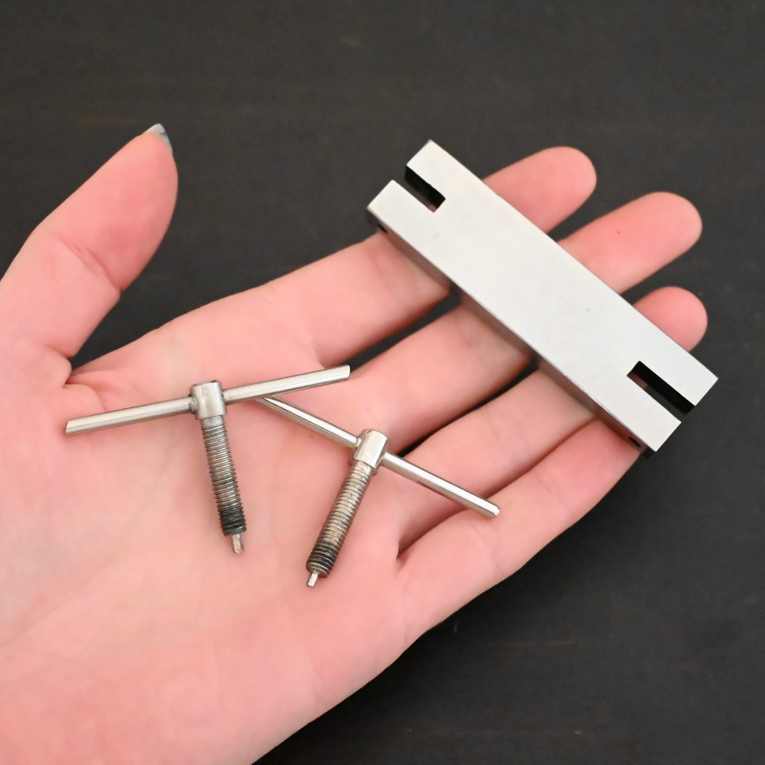 Stainless Steel Hole Punch & Twist Tool shown in hand