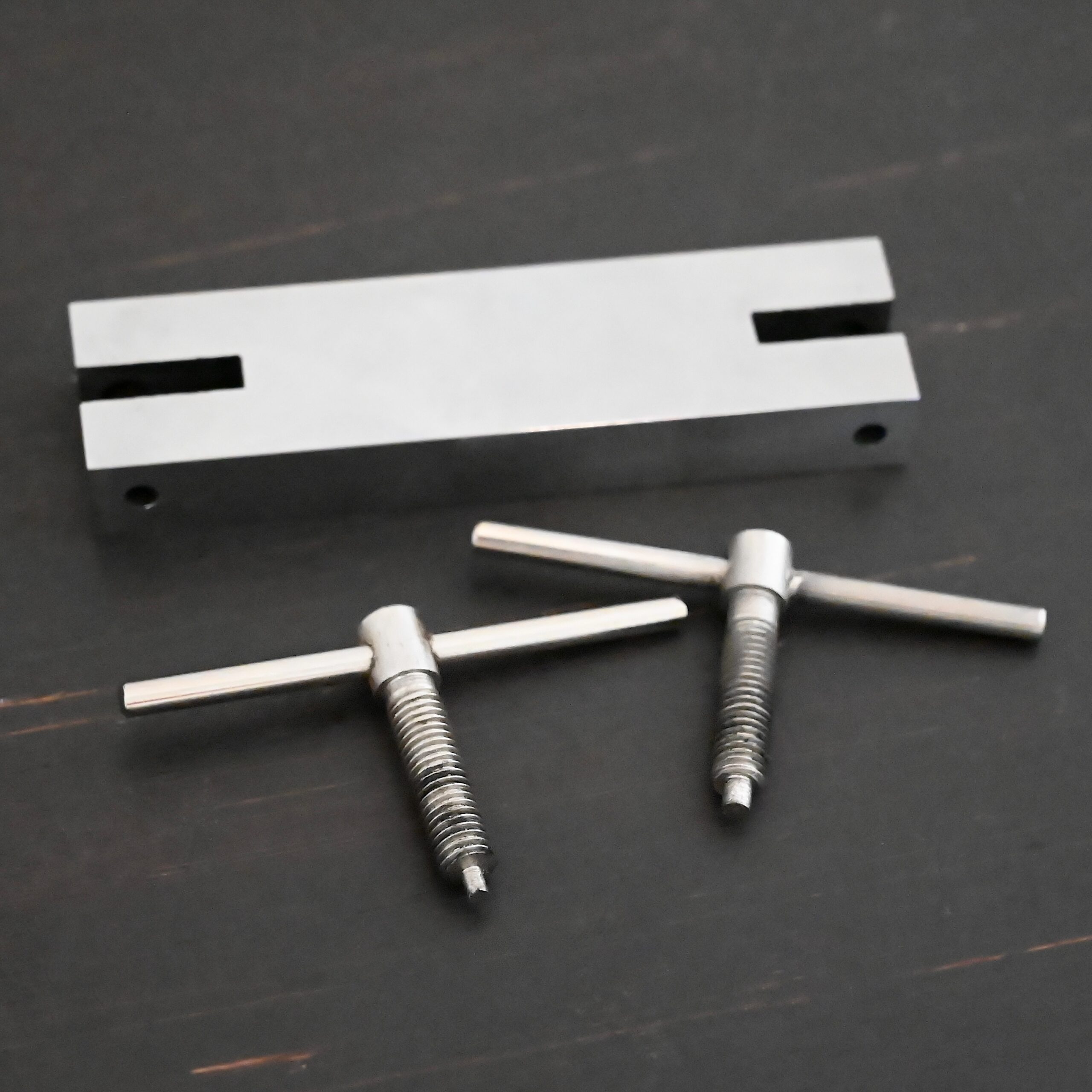 Stainless Steel Hole Punch & Twist Tool shown on dark background