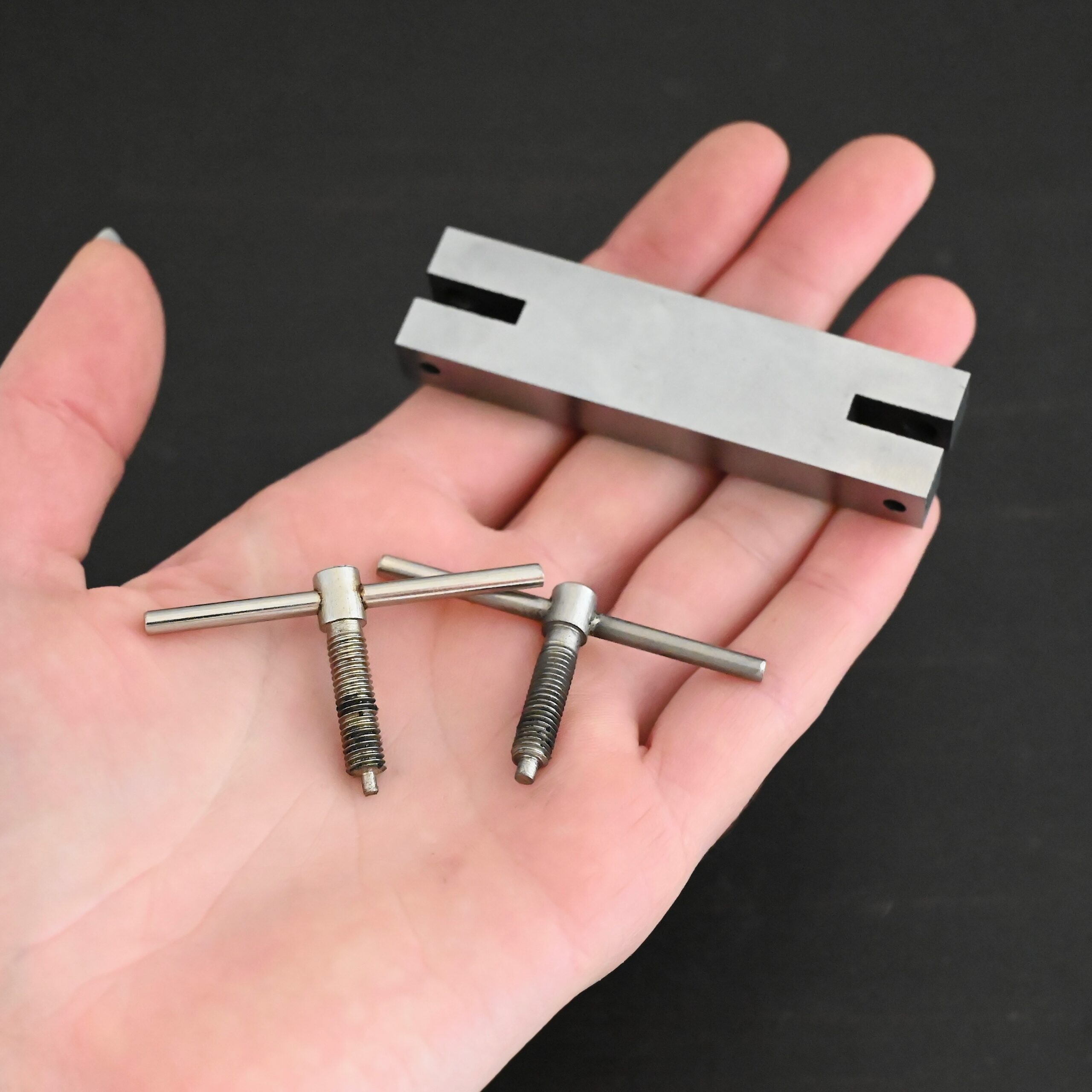 Stainless Steel Hole Punch & Twist Tool shown in hand