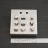 Stainless Steel Disc Cutter Showing all punches shown next to ruler