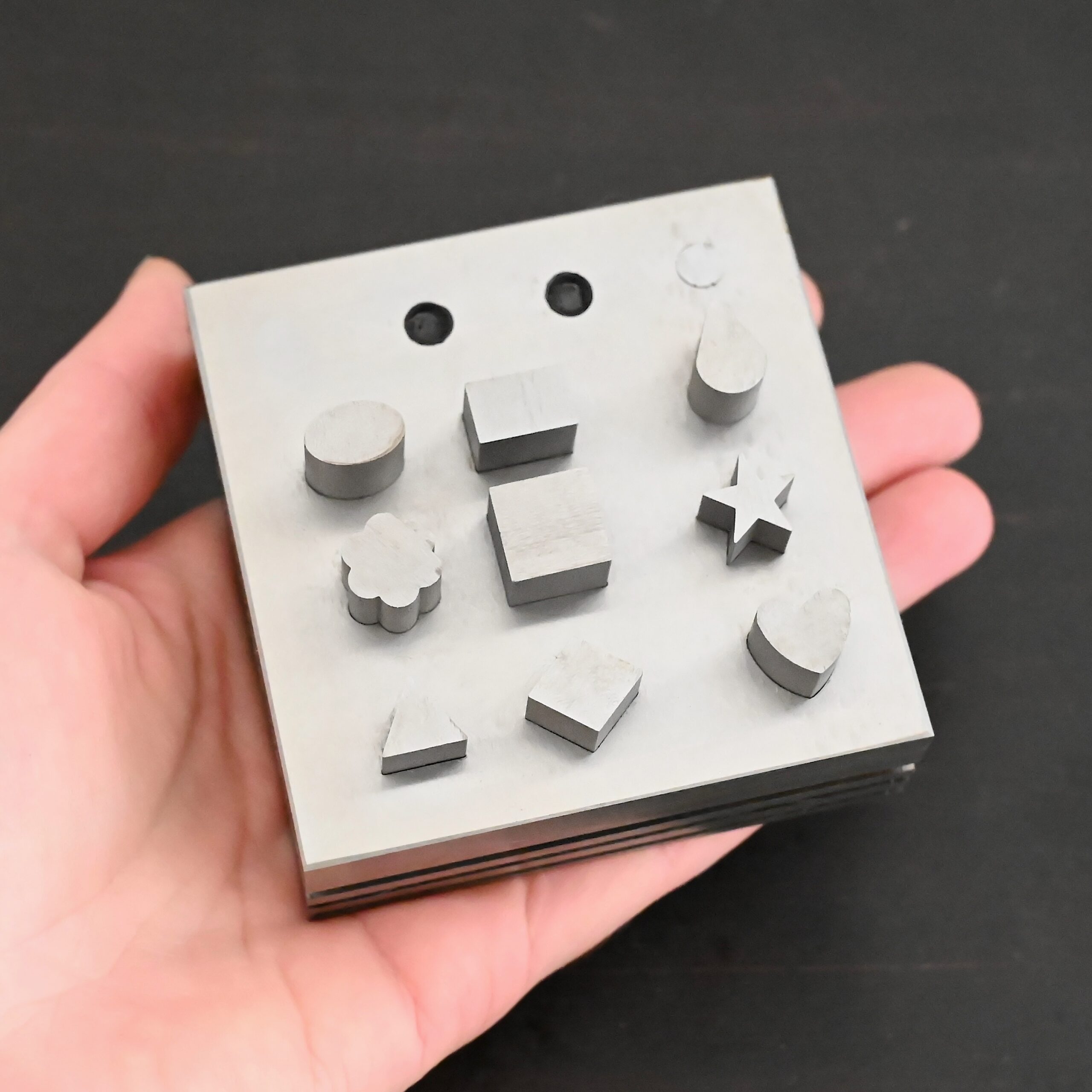 Stainless Steel Disc Cutter Showing all punches shown in hand