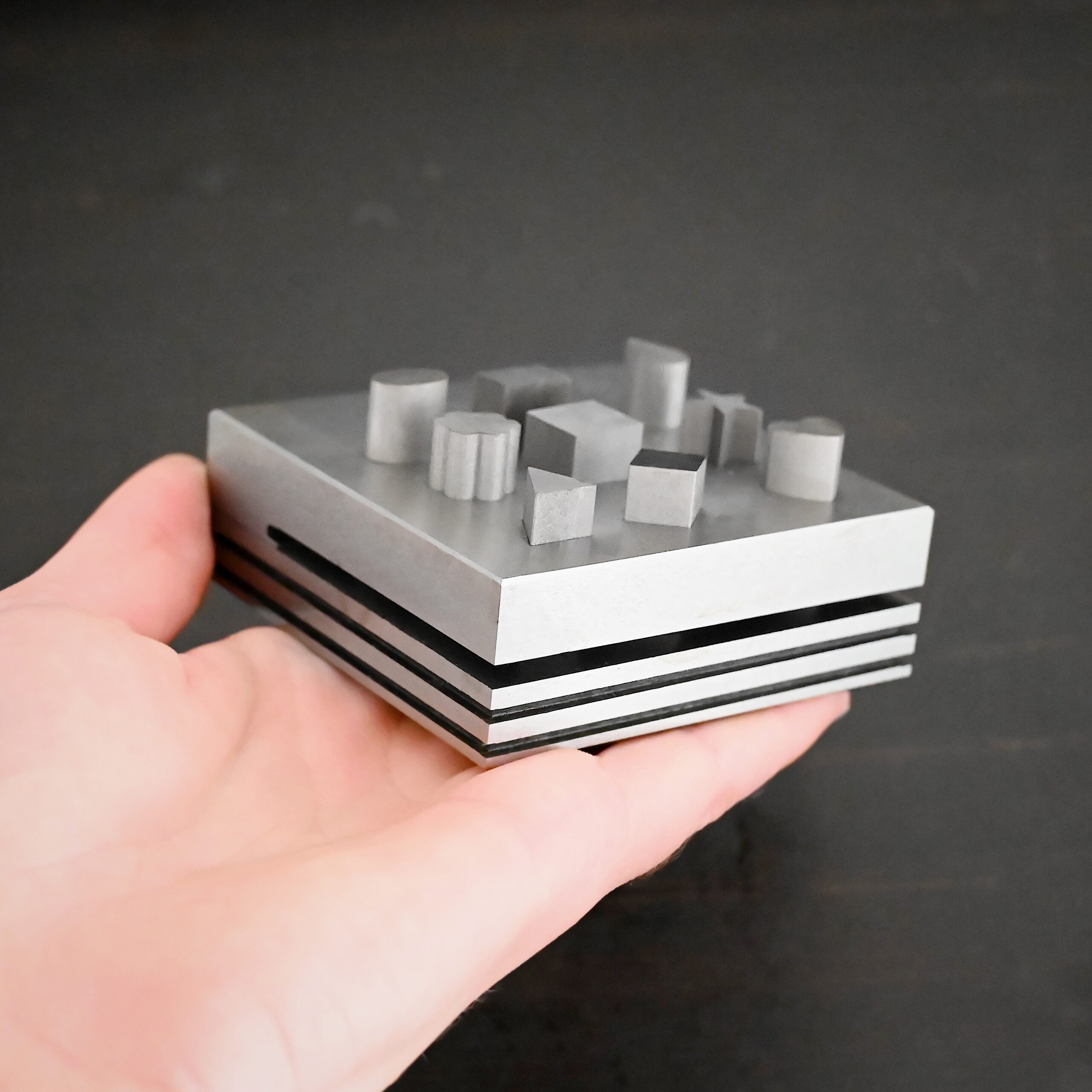 Stainless Steel Disc Cutter Showing all punches shown in hand