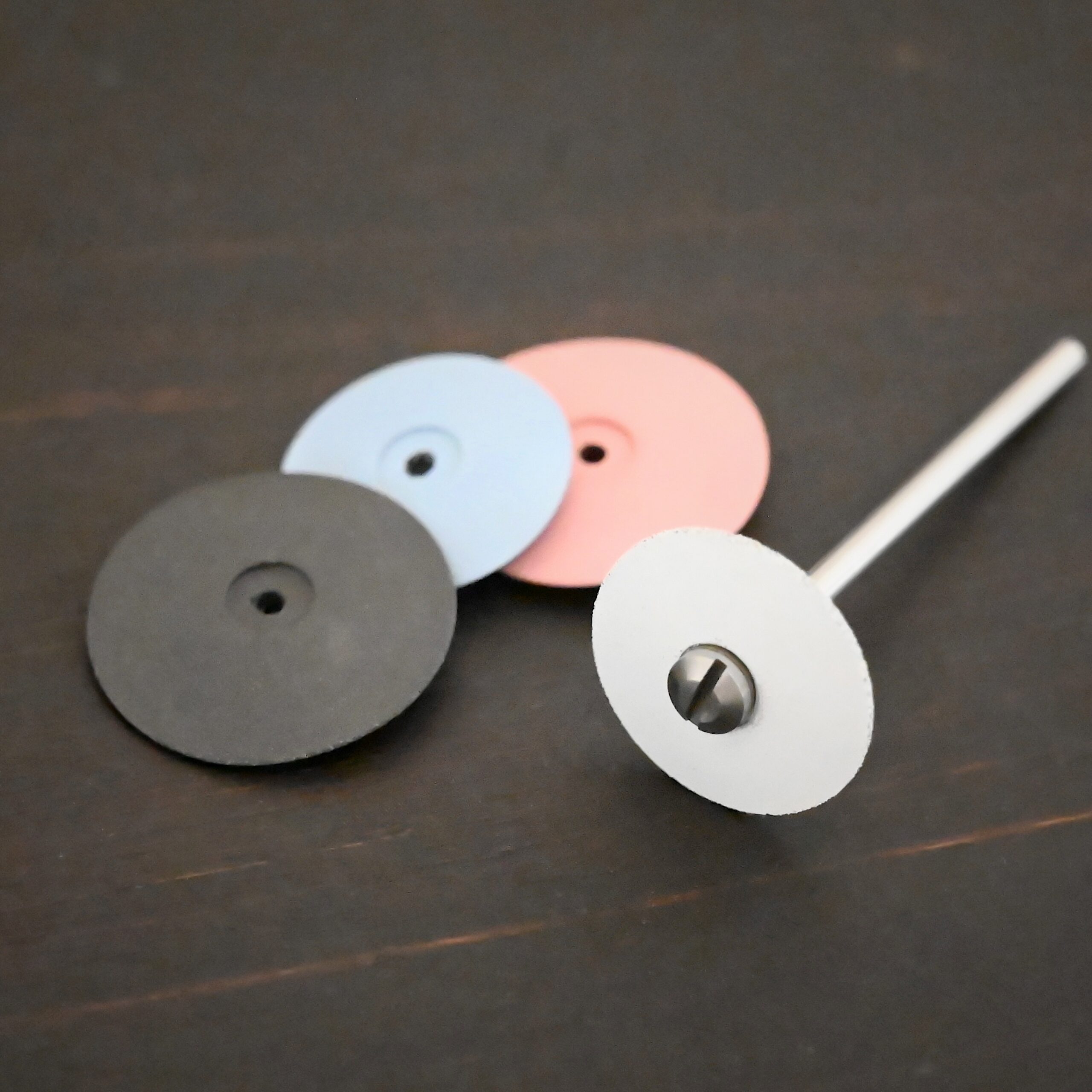 All Polishing Wheels & mandrel shown on dark background