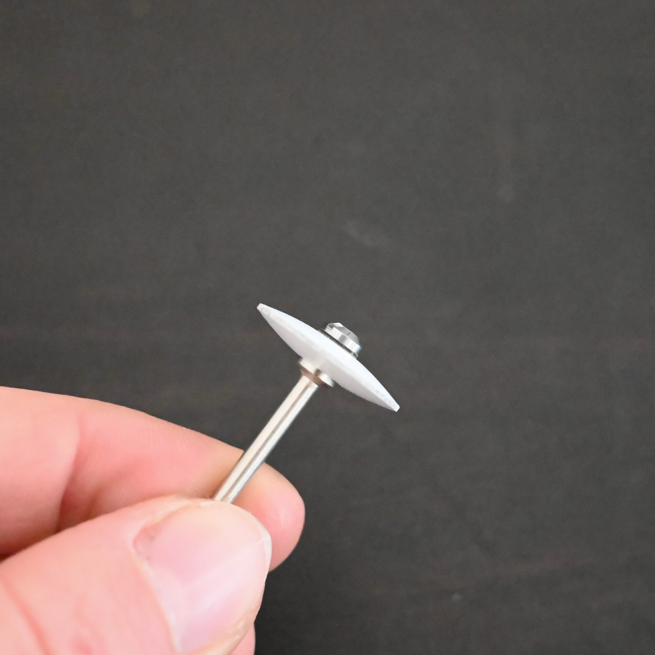 White Wheel shown on mandrel in hand