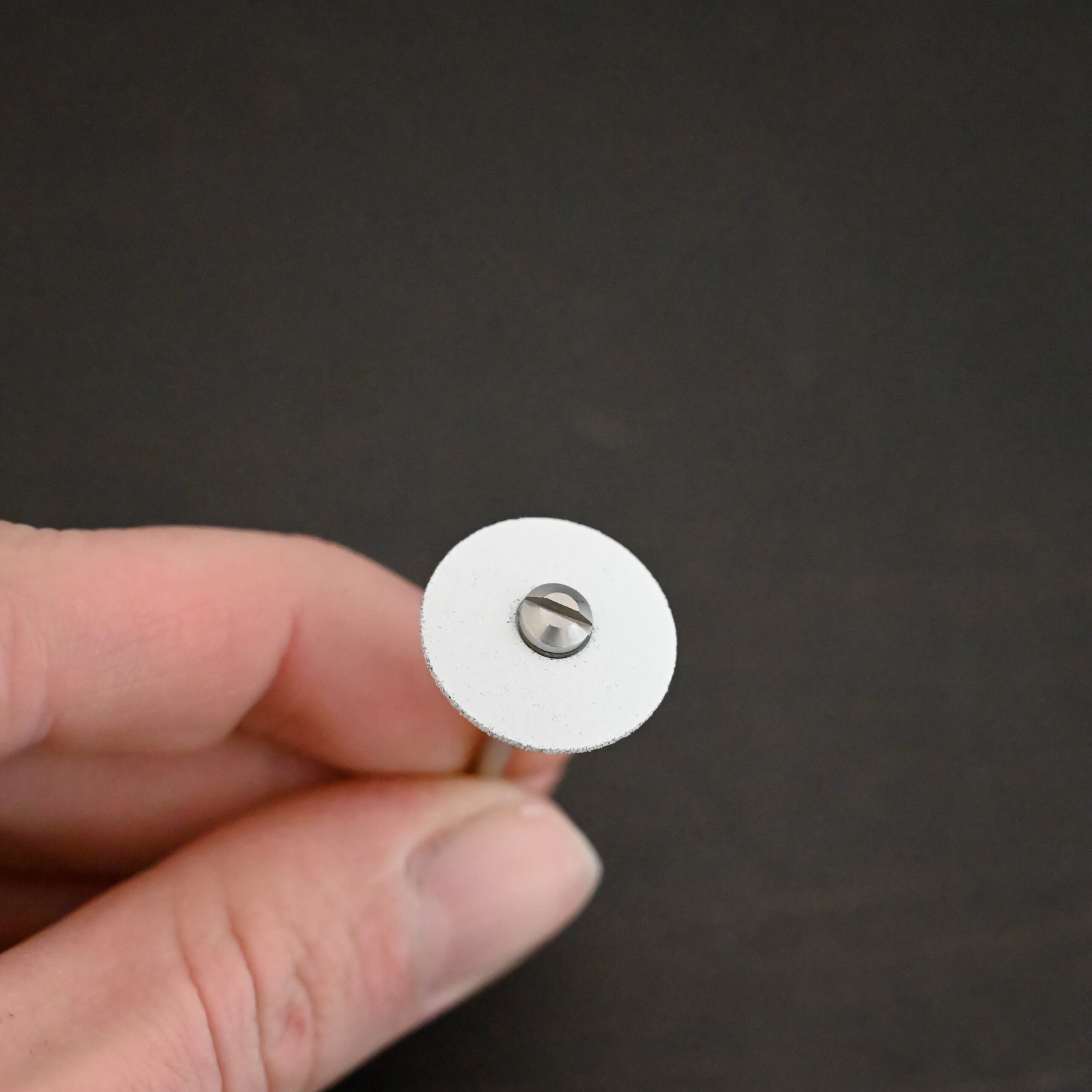 White Wheel shown on mandrel in hand