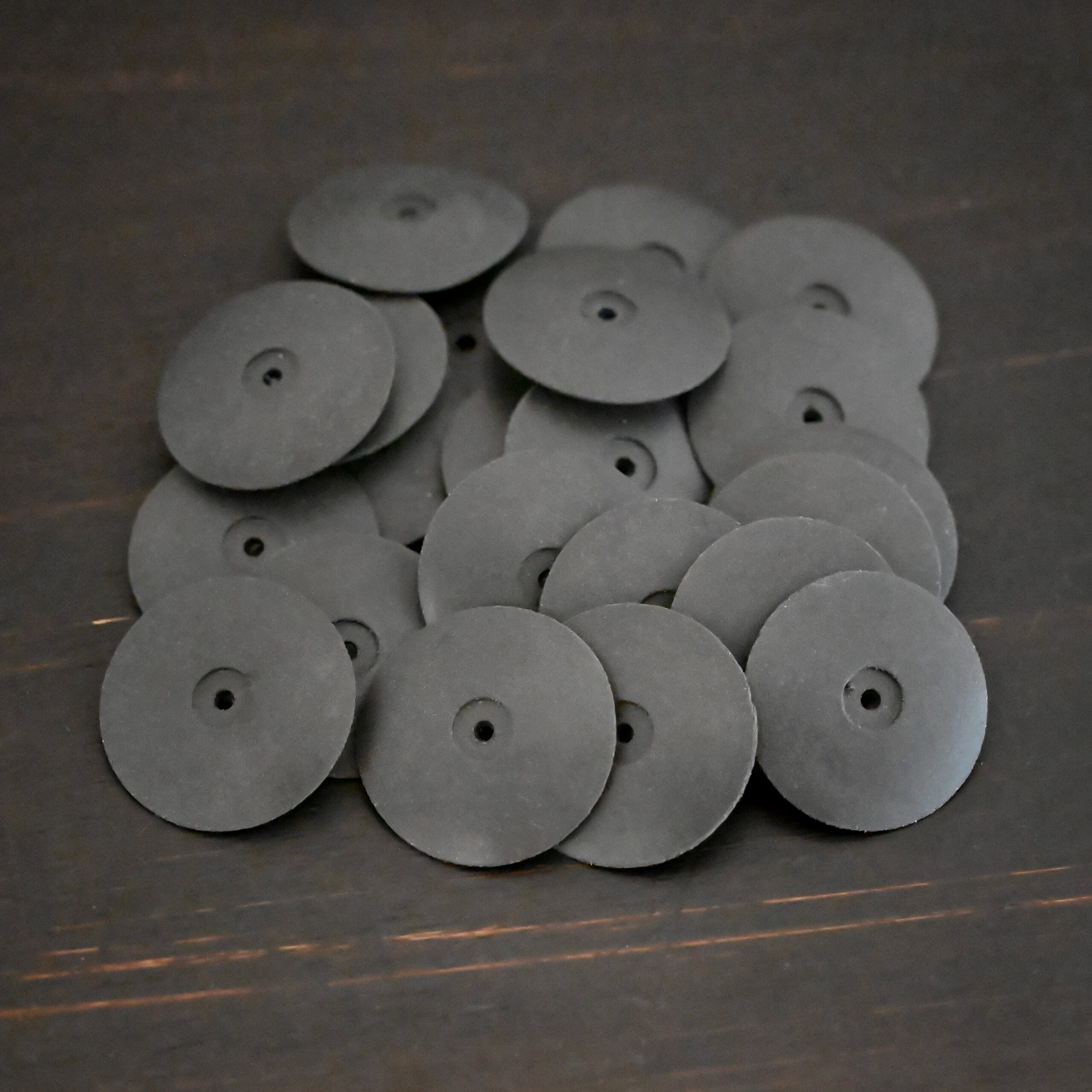 Black Polishing Wheels shown on dark background