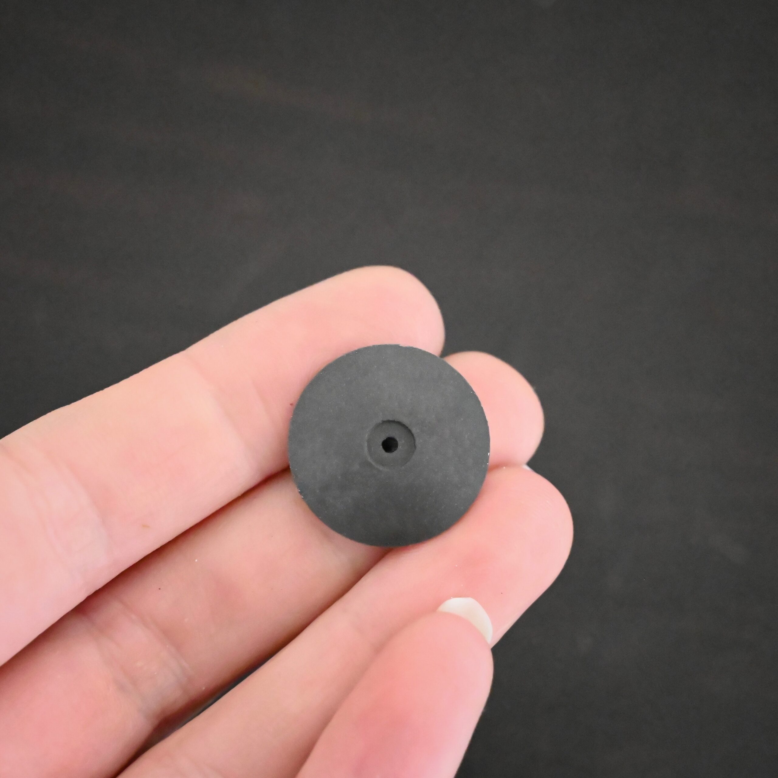 Black Polishing Wheel shown in hand