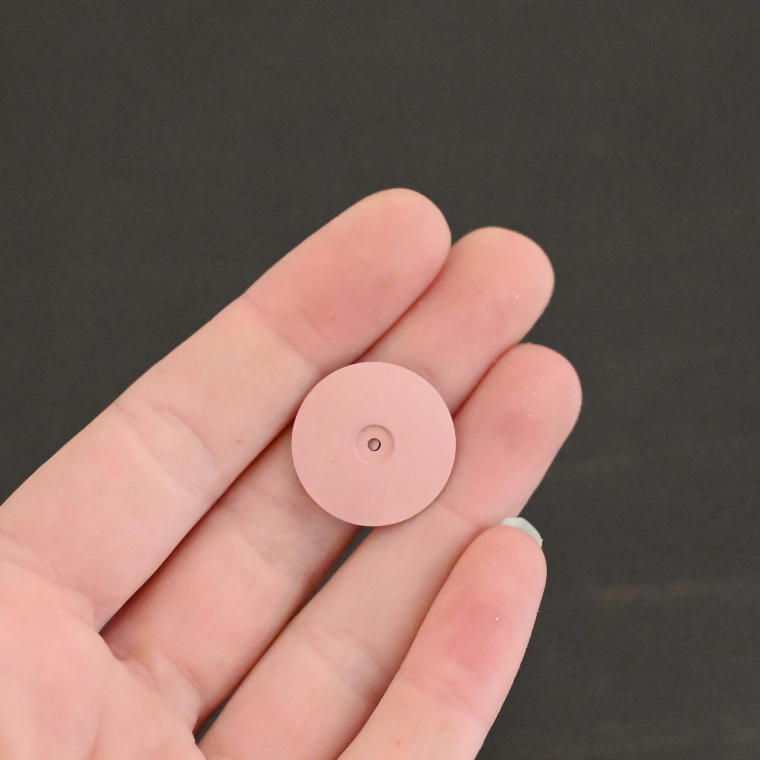 Pink Polishing Wheel shown in hand