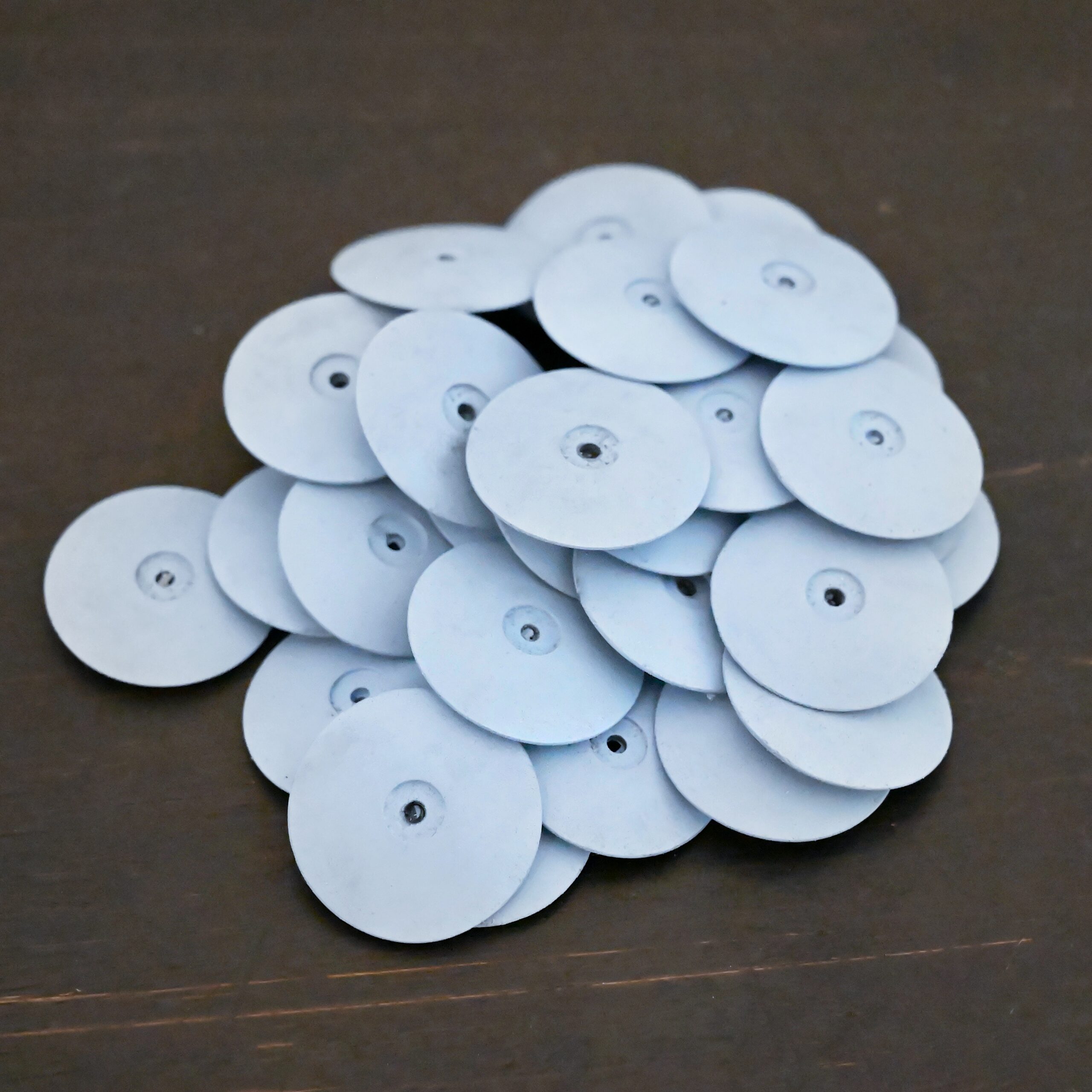 Blue Polishing Wheels shown on dark background