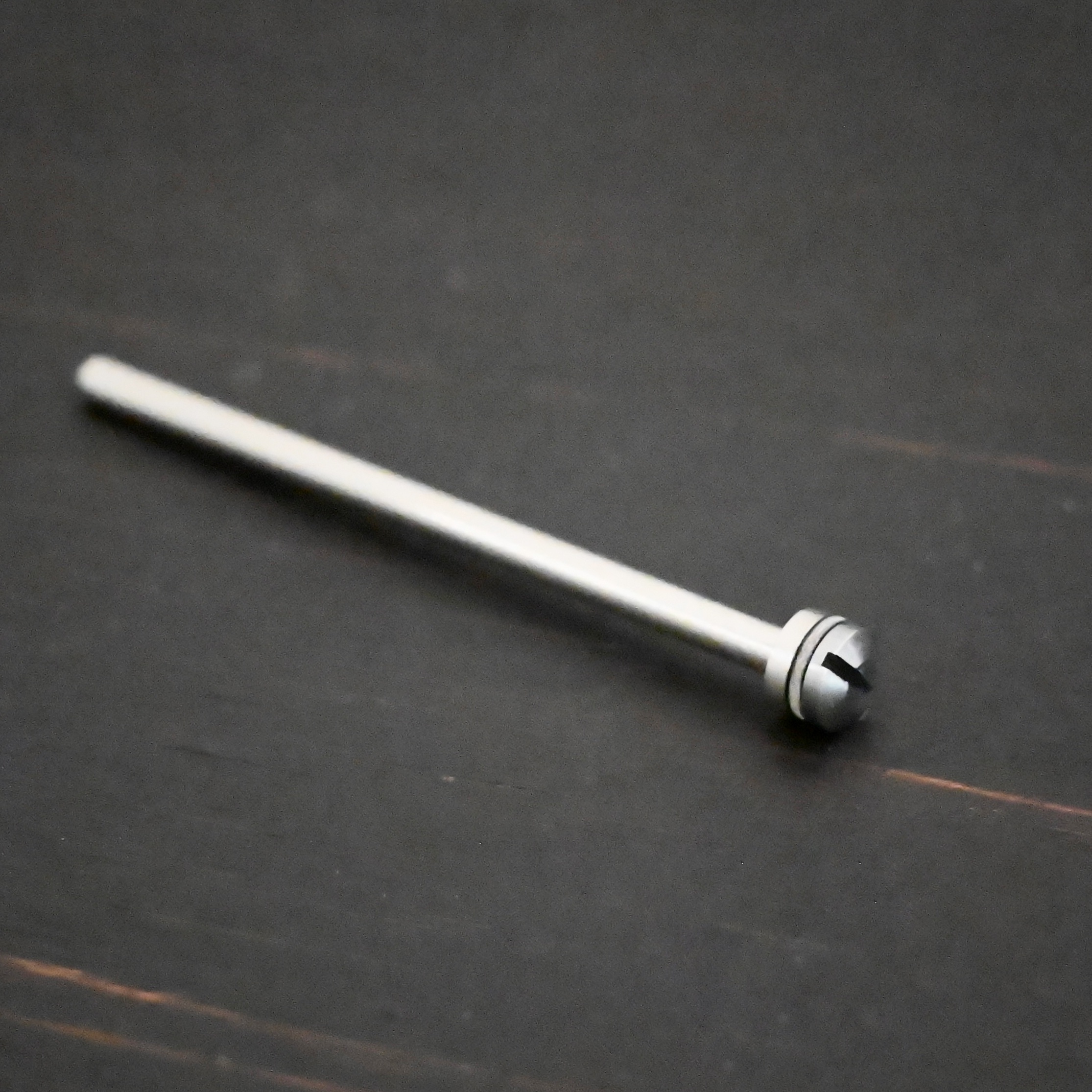 Stainless Steel Polishing Wheel Mandrel shown on dark background