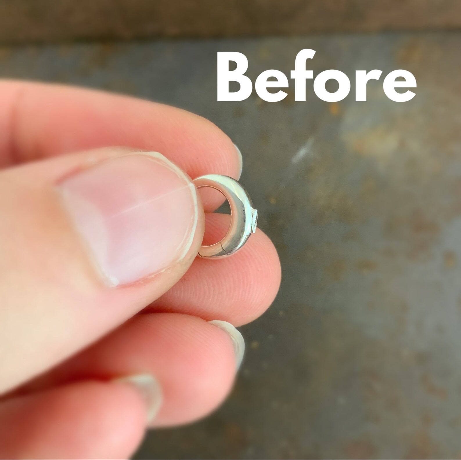 Shows before using the polishing wheels on stainless steel clasp with burs on it in hand