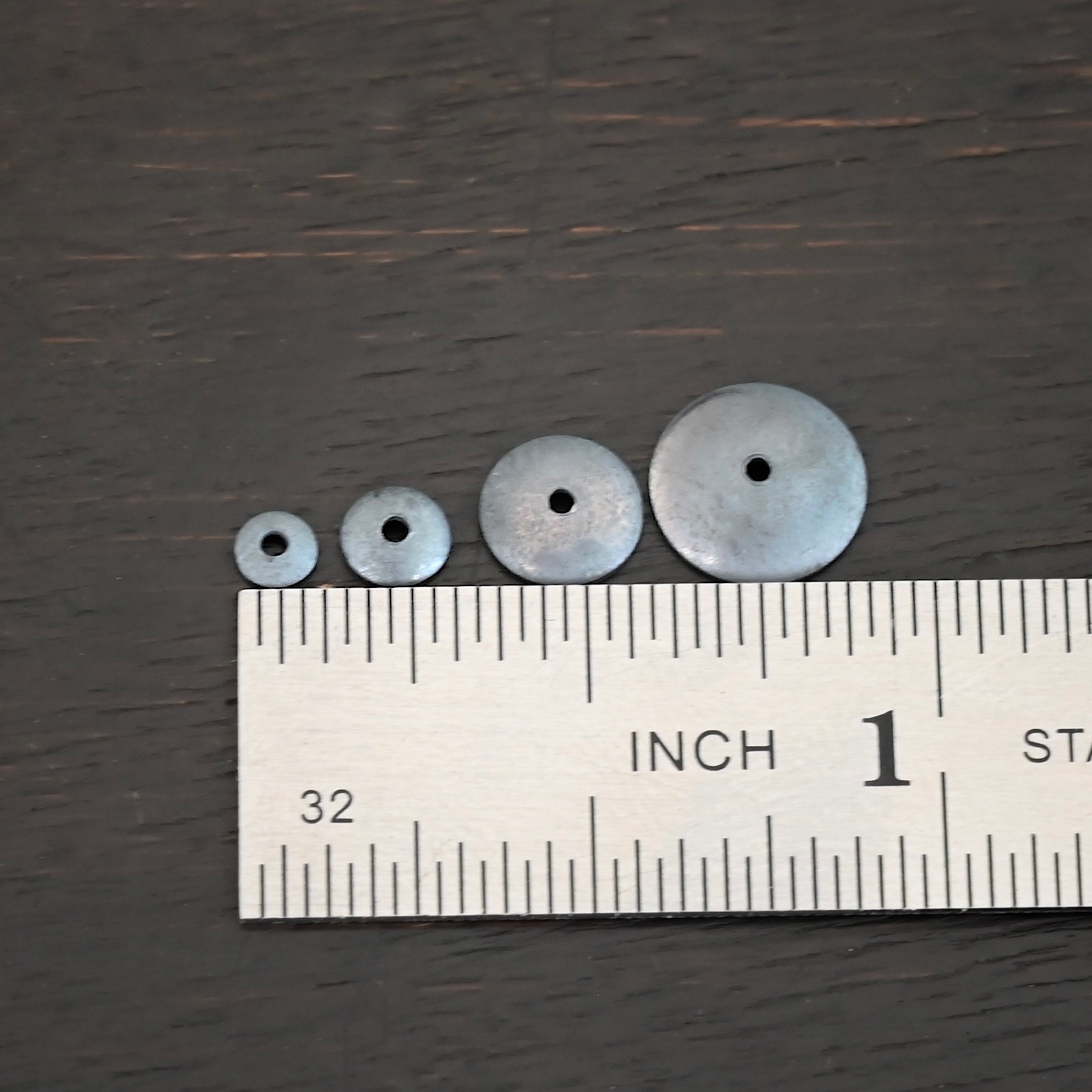 Silver oxidized bead caps all sizes shown by ruler