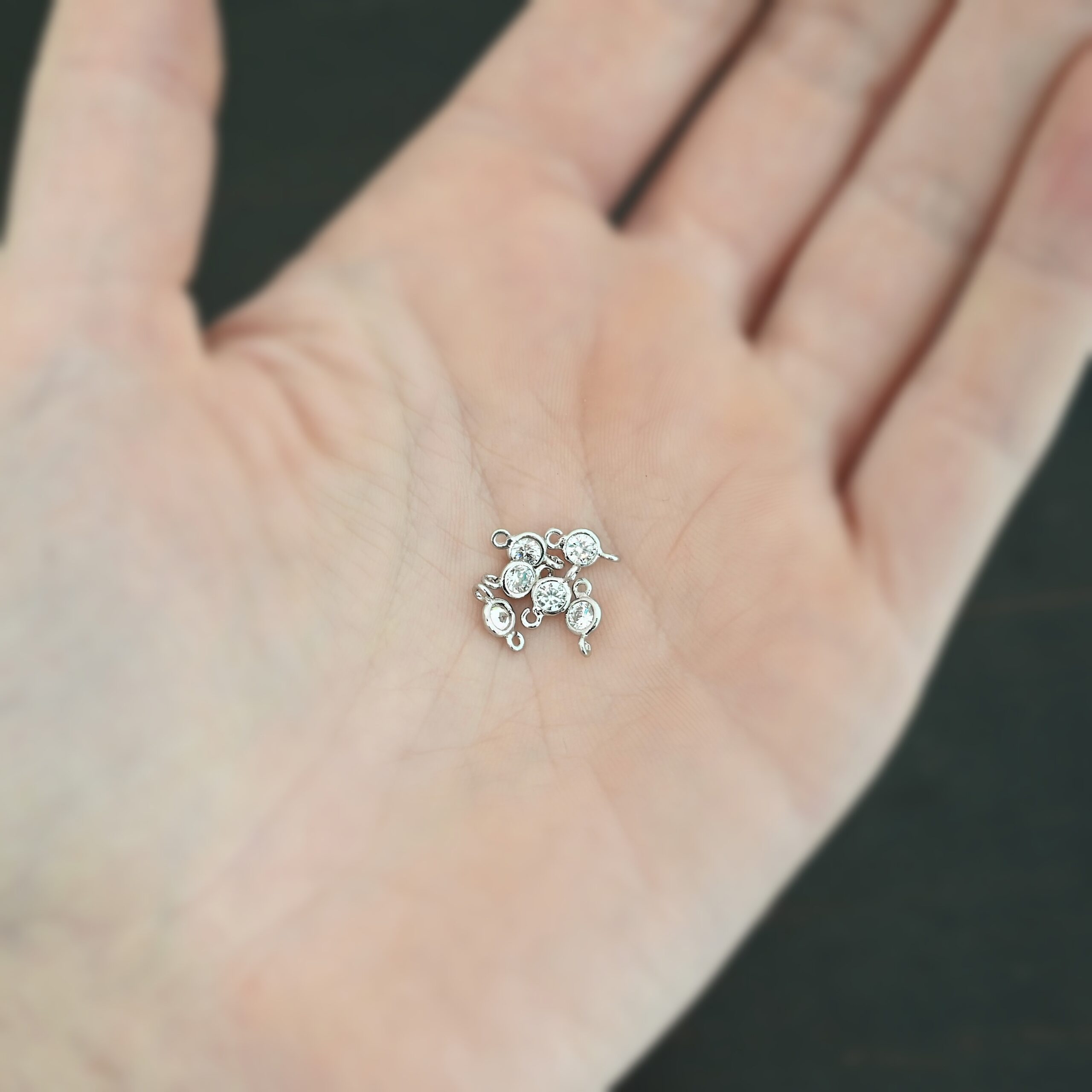 Silver Plated Cubic Zirconia link shown in hand
