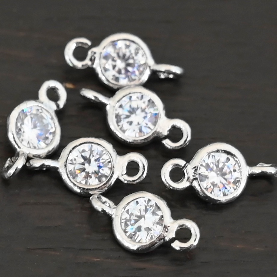 Silver Plated Cubic Zirconia link shown on dark background