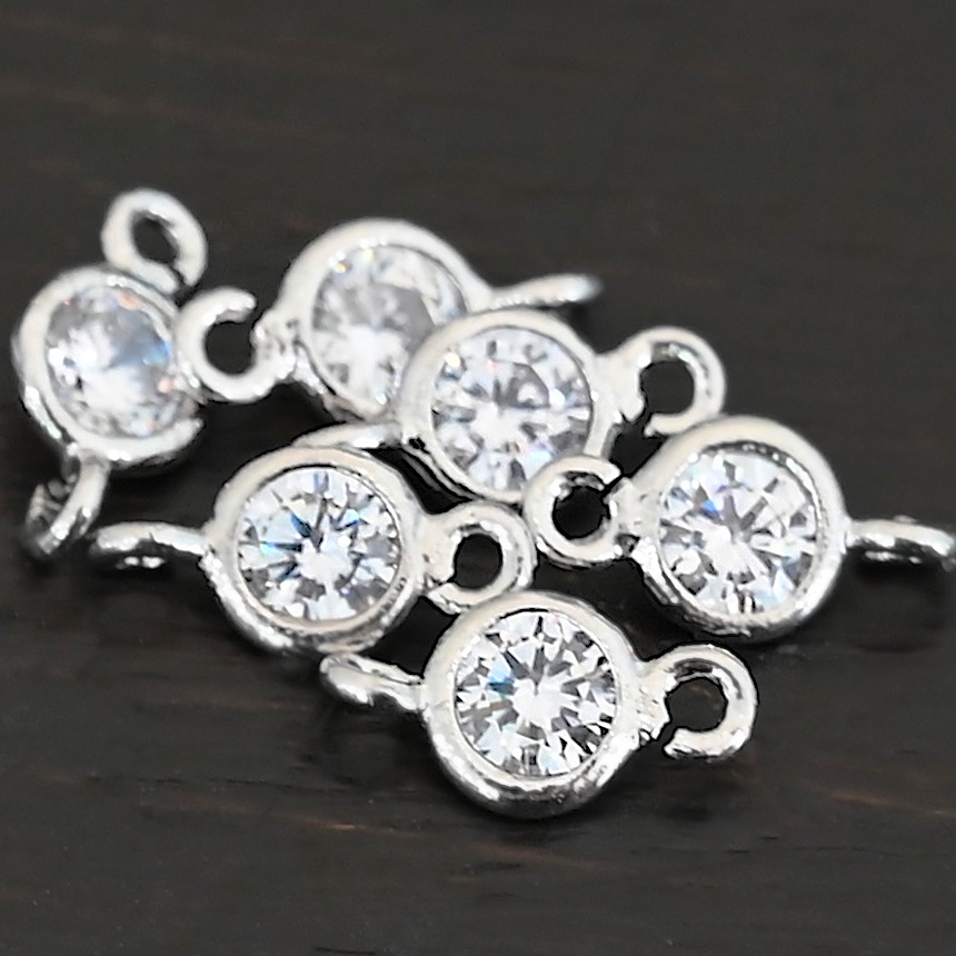 Silver Plated Cubic Zirconia link shown on dark background