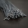 oxidized small ball headpins shown in dark background