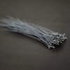 oxidized small ball headpins shown in dark background