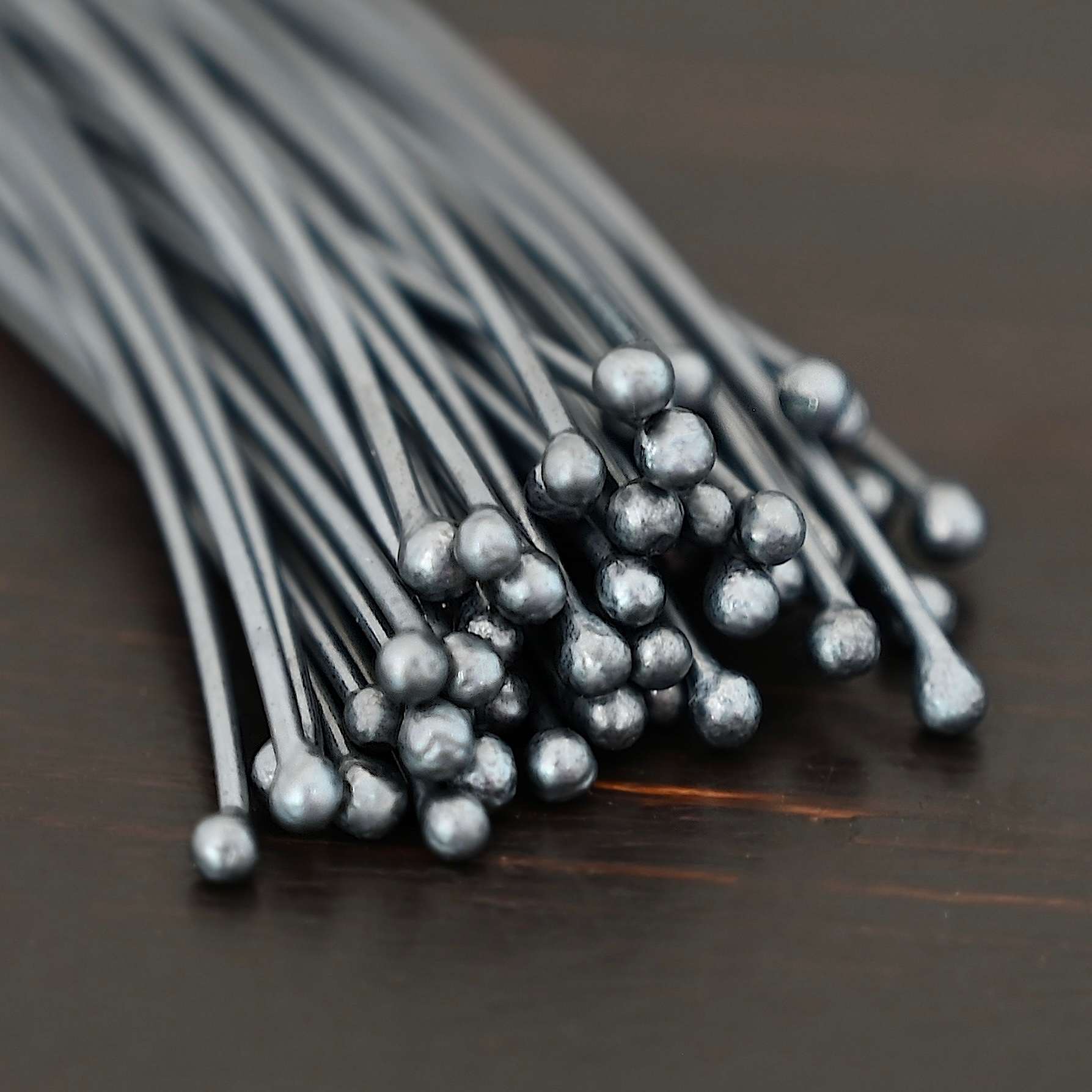Large Ball oxidized headpins shown on dark background