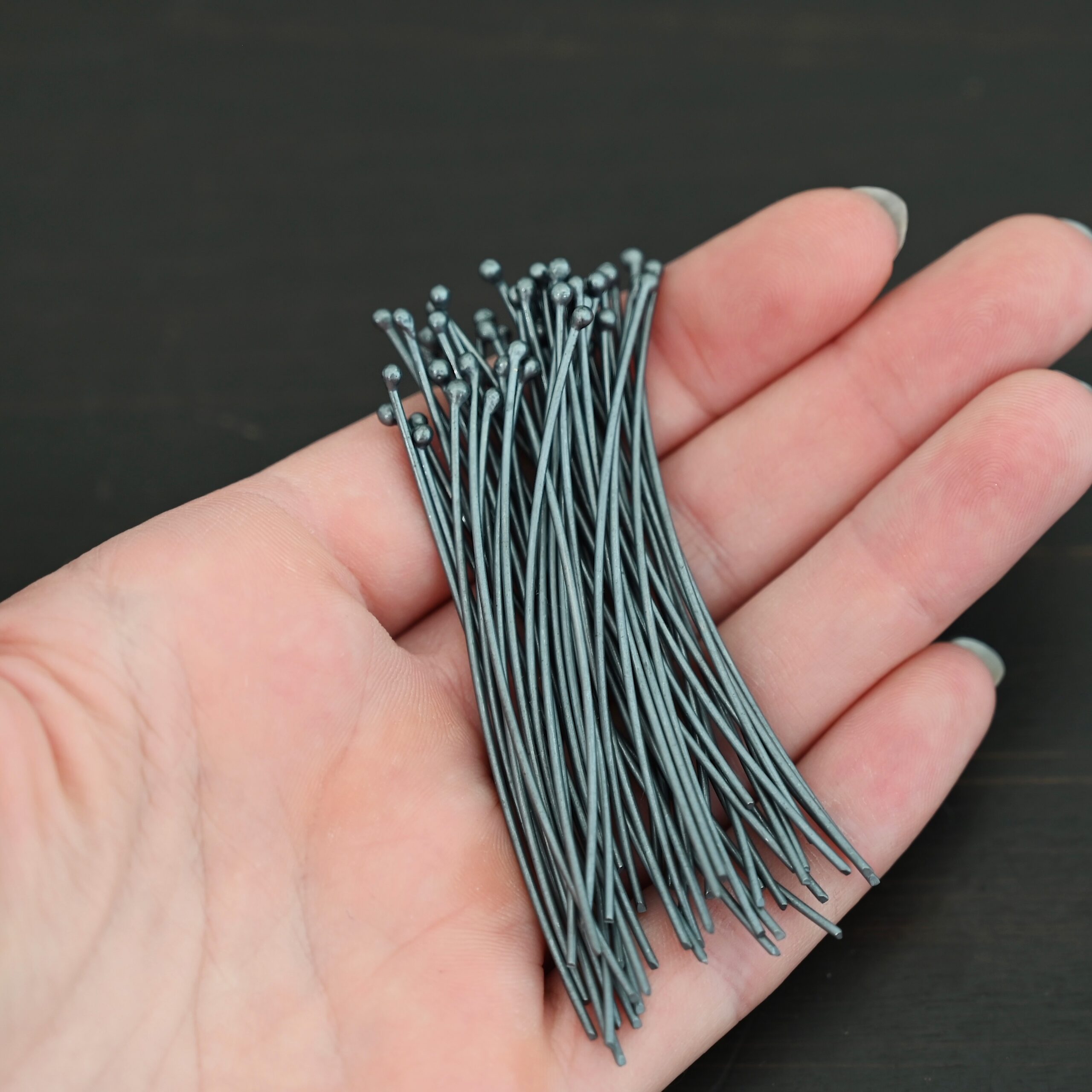 18 gauge 2" oxidized headpins 50pcs shown in hand