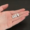 Handmade shiny end caps shown in hand