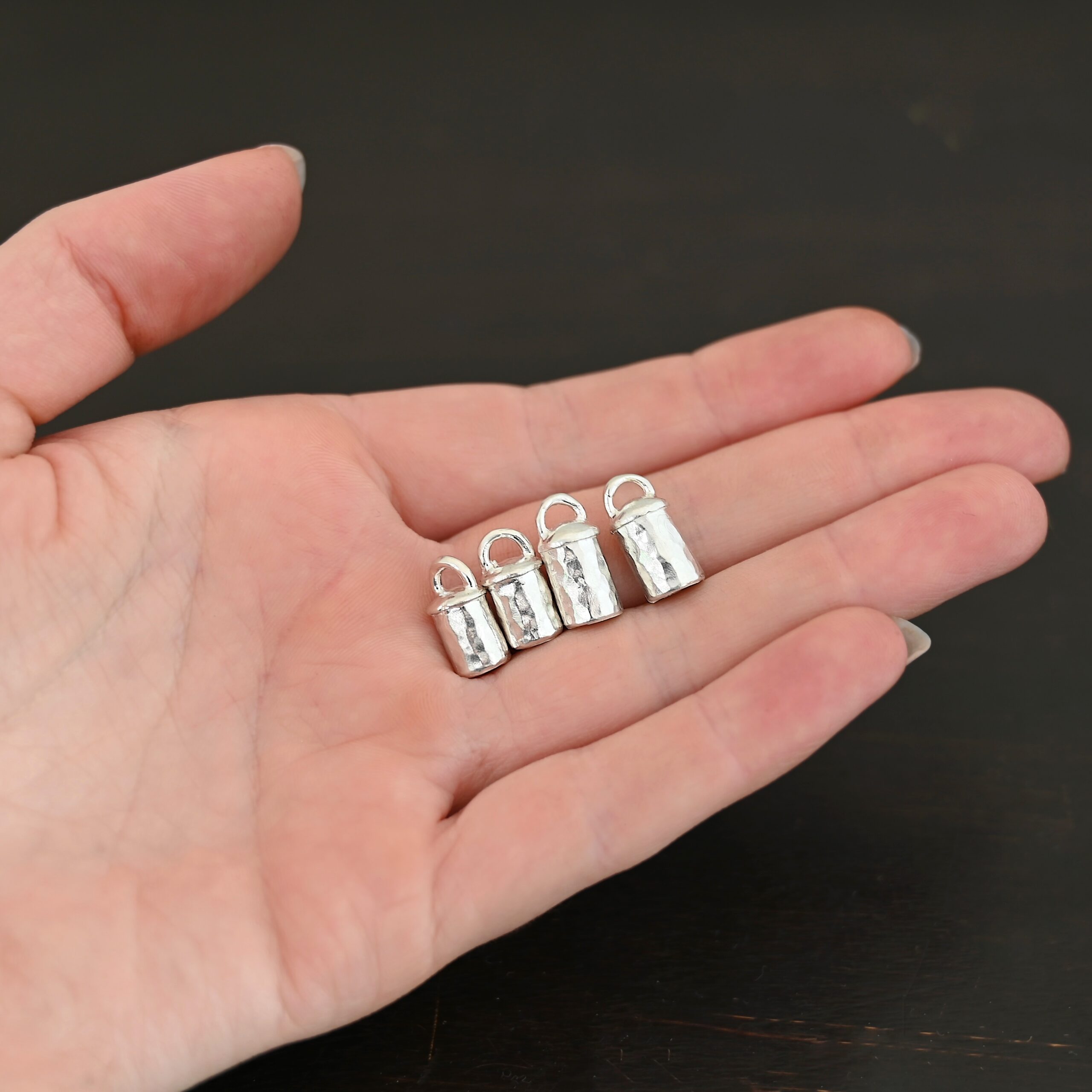 Handmade shiny end caps Handmade shiny end caps shown in hand