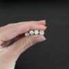 Handmade shiny end caps shown in hand