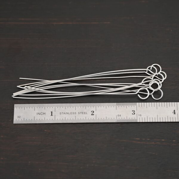 Eyepins shiny 10pcs shown by ruler