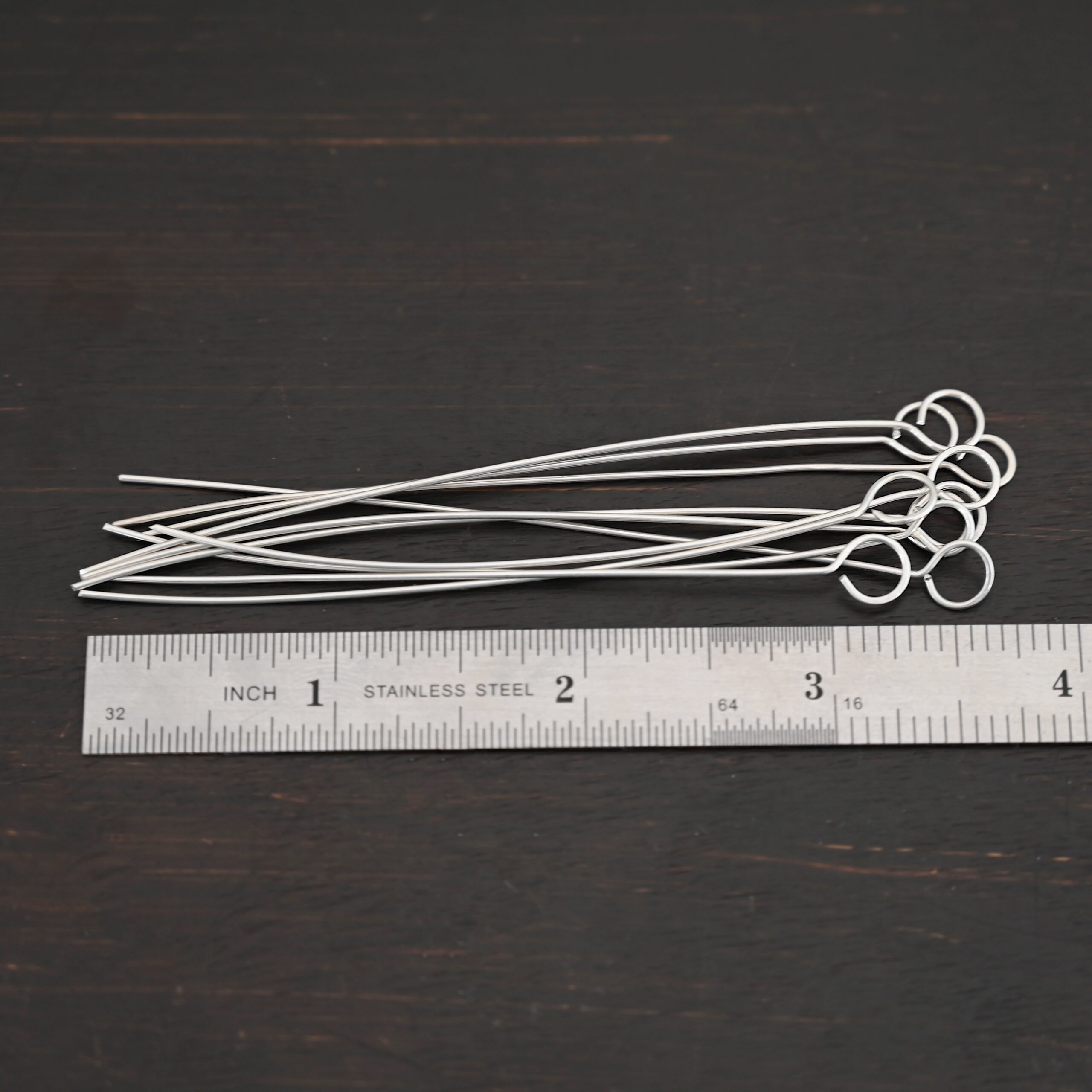 Eyepins shiny 10pcs shown by ruler