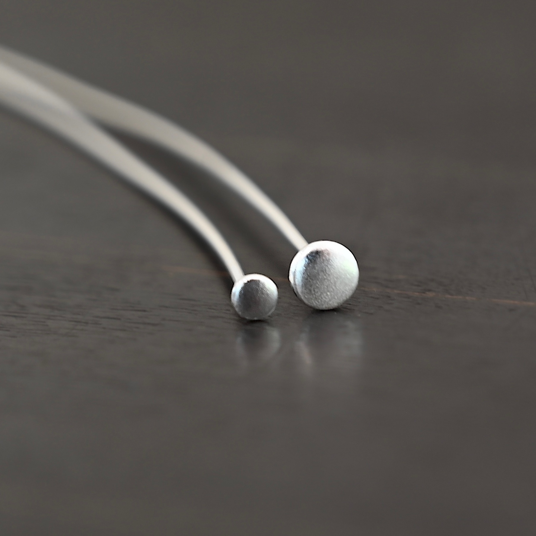 Nail Headpins shiny shown on dark background