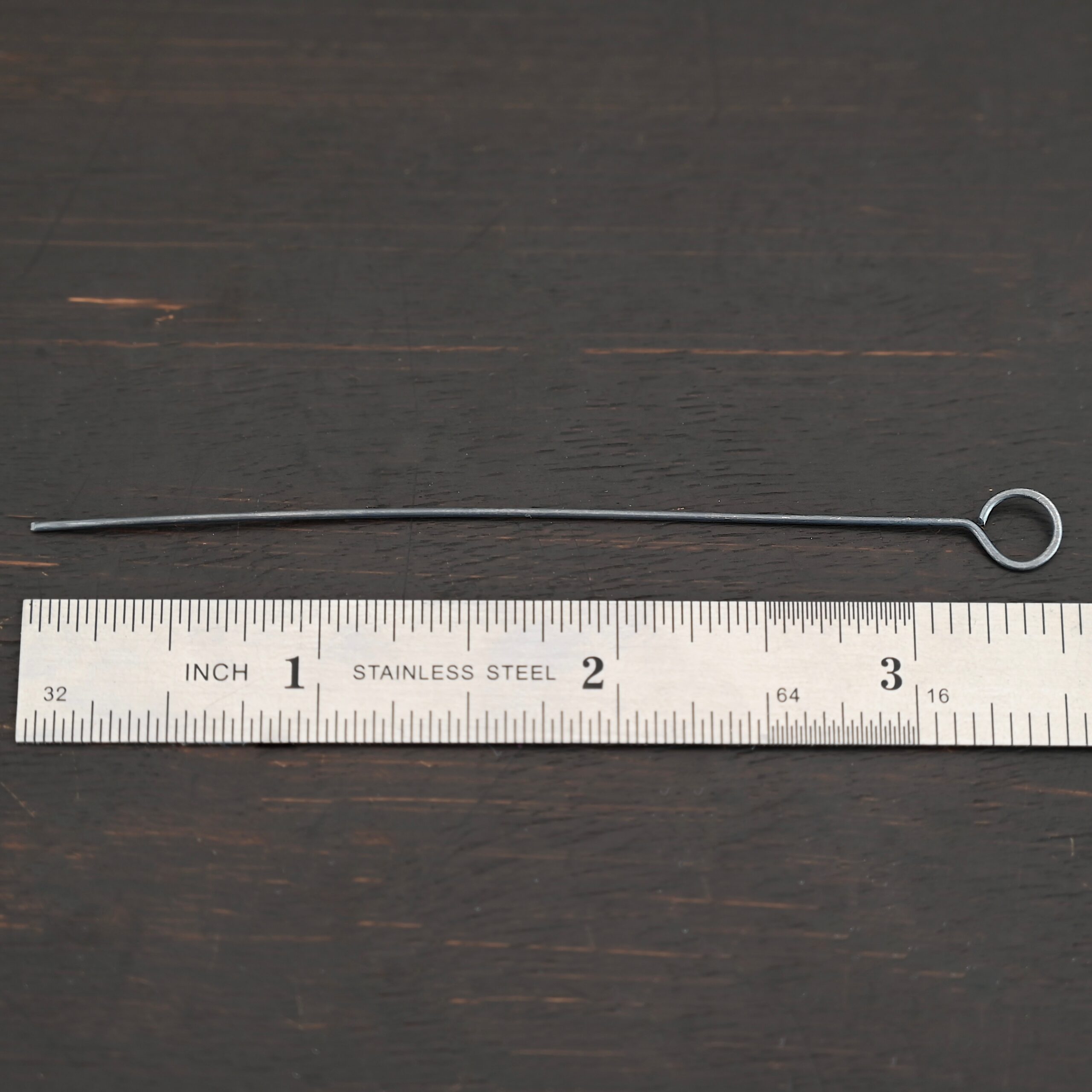 Eyepins oxidized 1pc shown by ruler