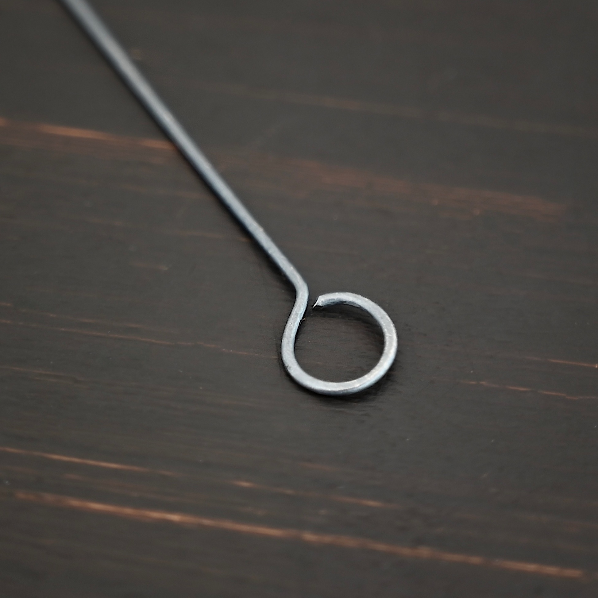 Eyepins oxidized 1pc shown on dark background